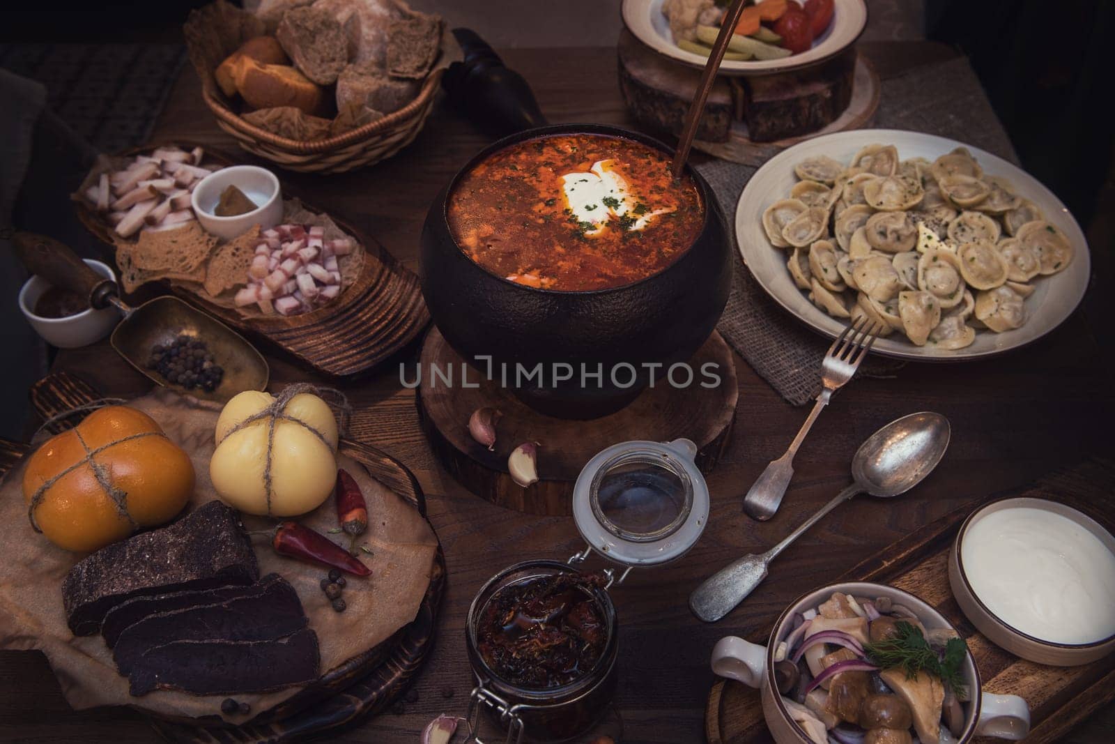 Russian food: borsch pickles cheese meat dumplings and fat
