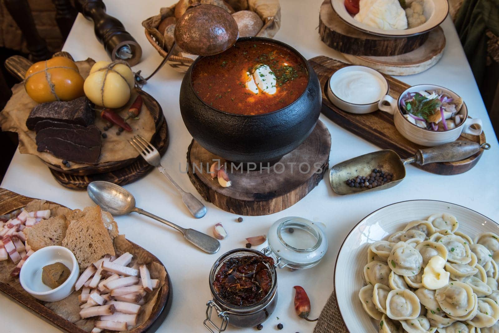 Russian food: borsch pickles cheese meat dumplings and fat