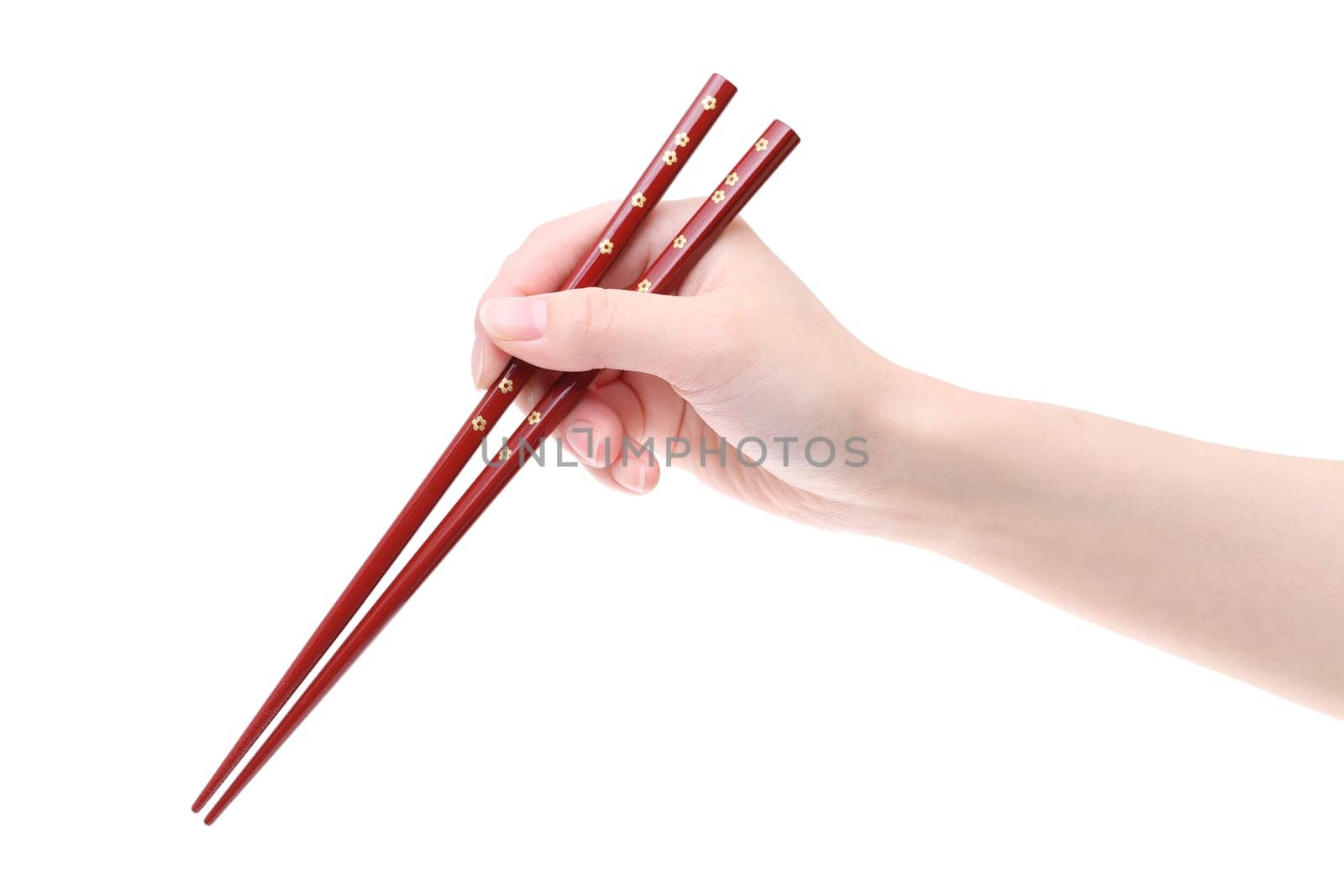 Hand holding wooden chopsticks isolated on white background