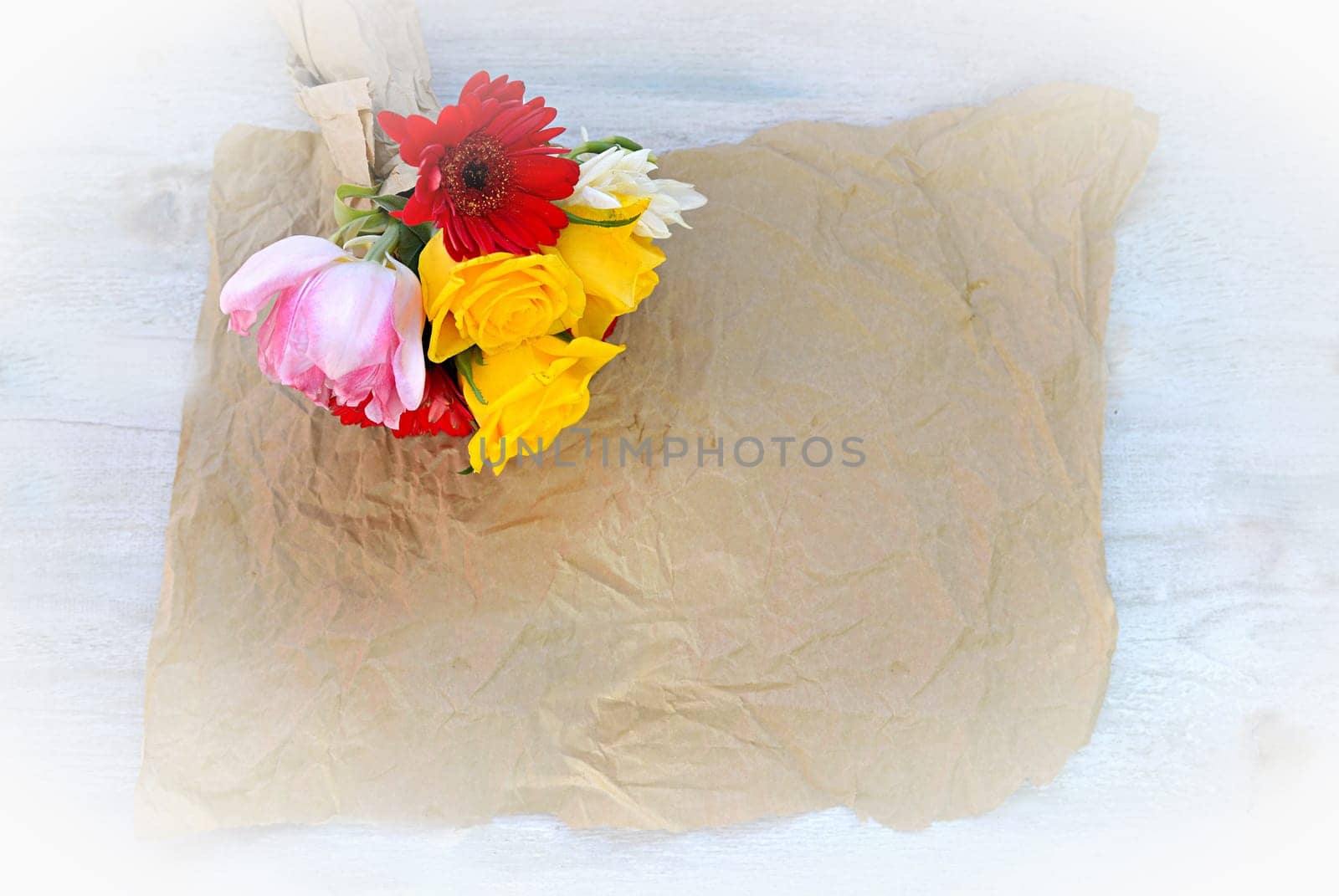 colourful bouquet of flowers on an old wooden background