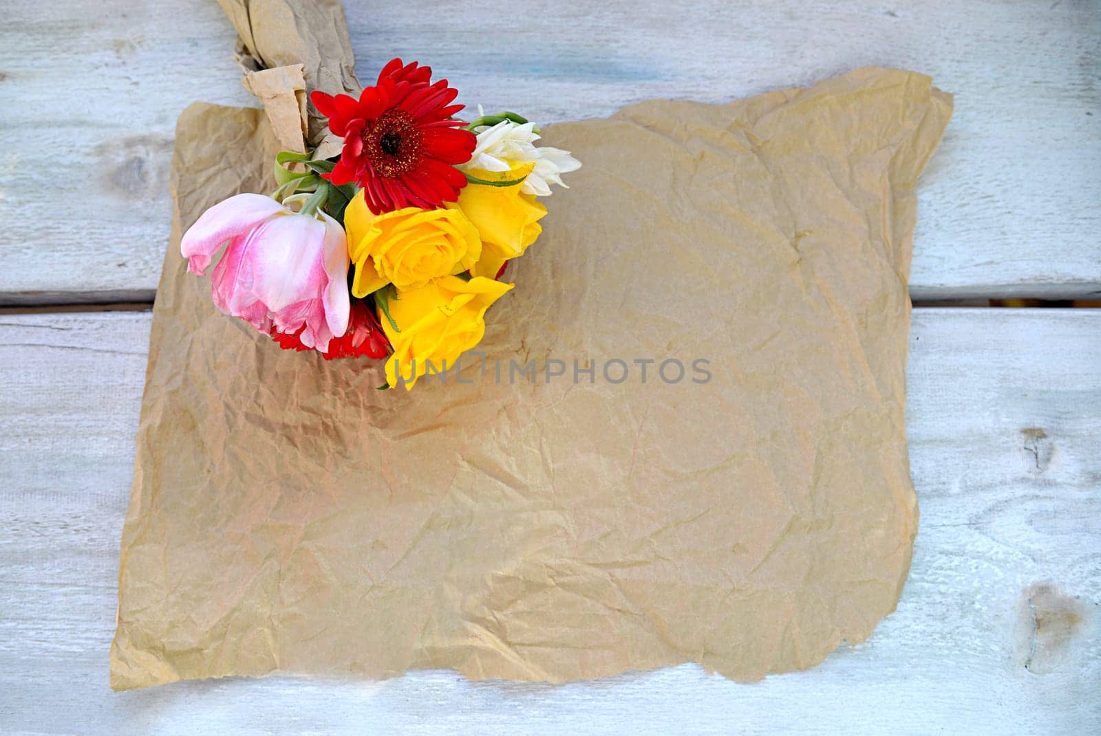 colourful bouquet of flowers on an old wooden background