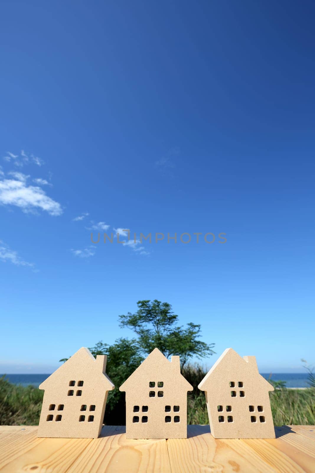 Miniature model of house with blue sky background