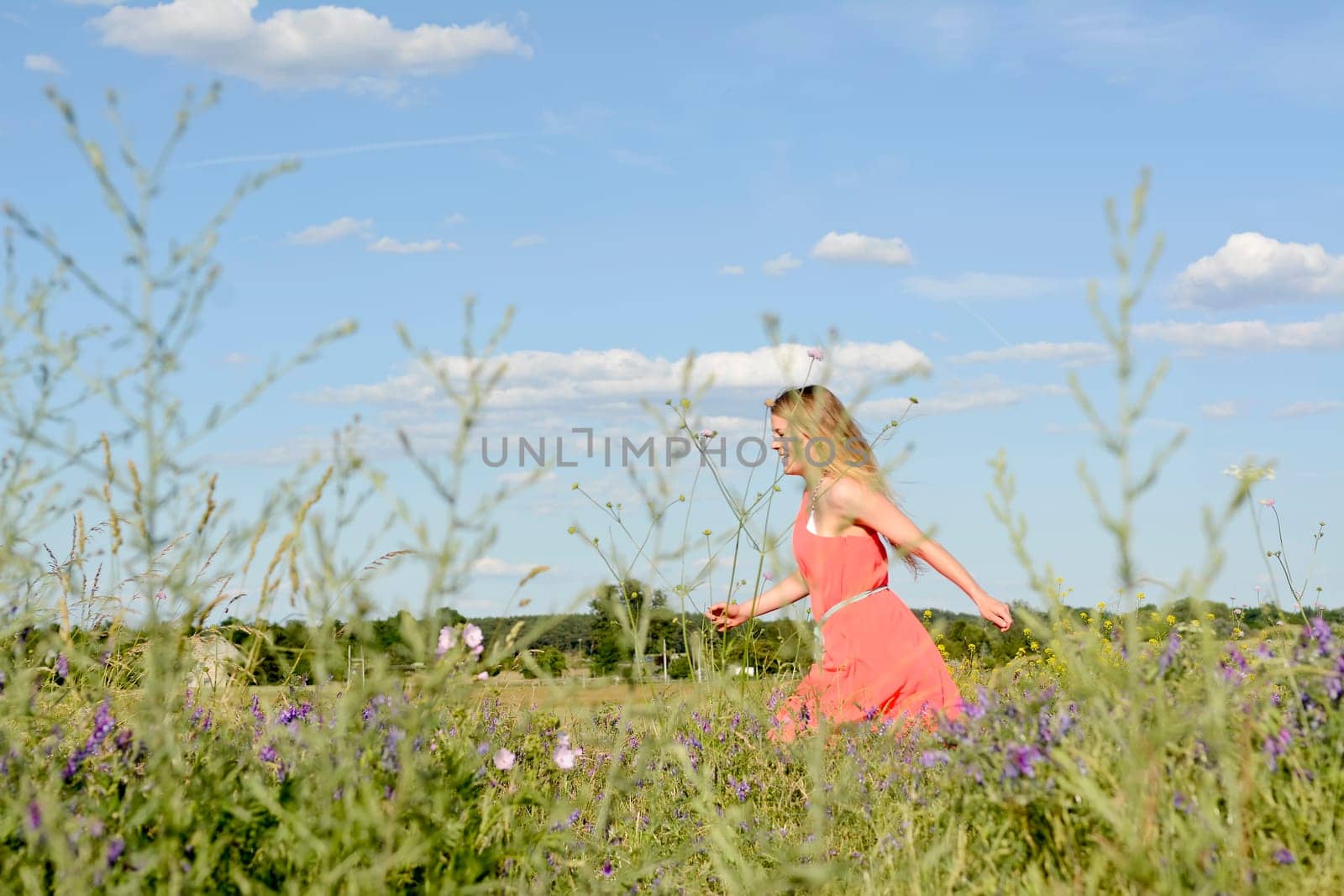 young woman on flower meadow