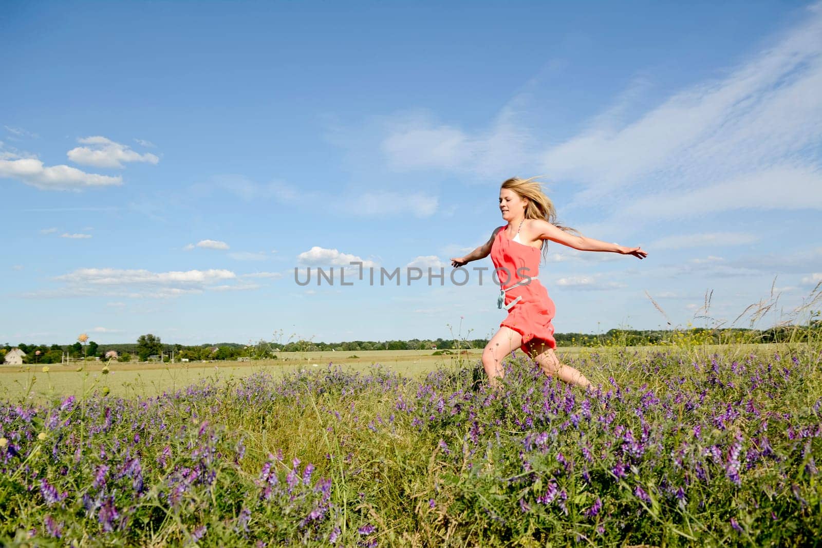young woman on flower meadow