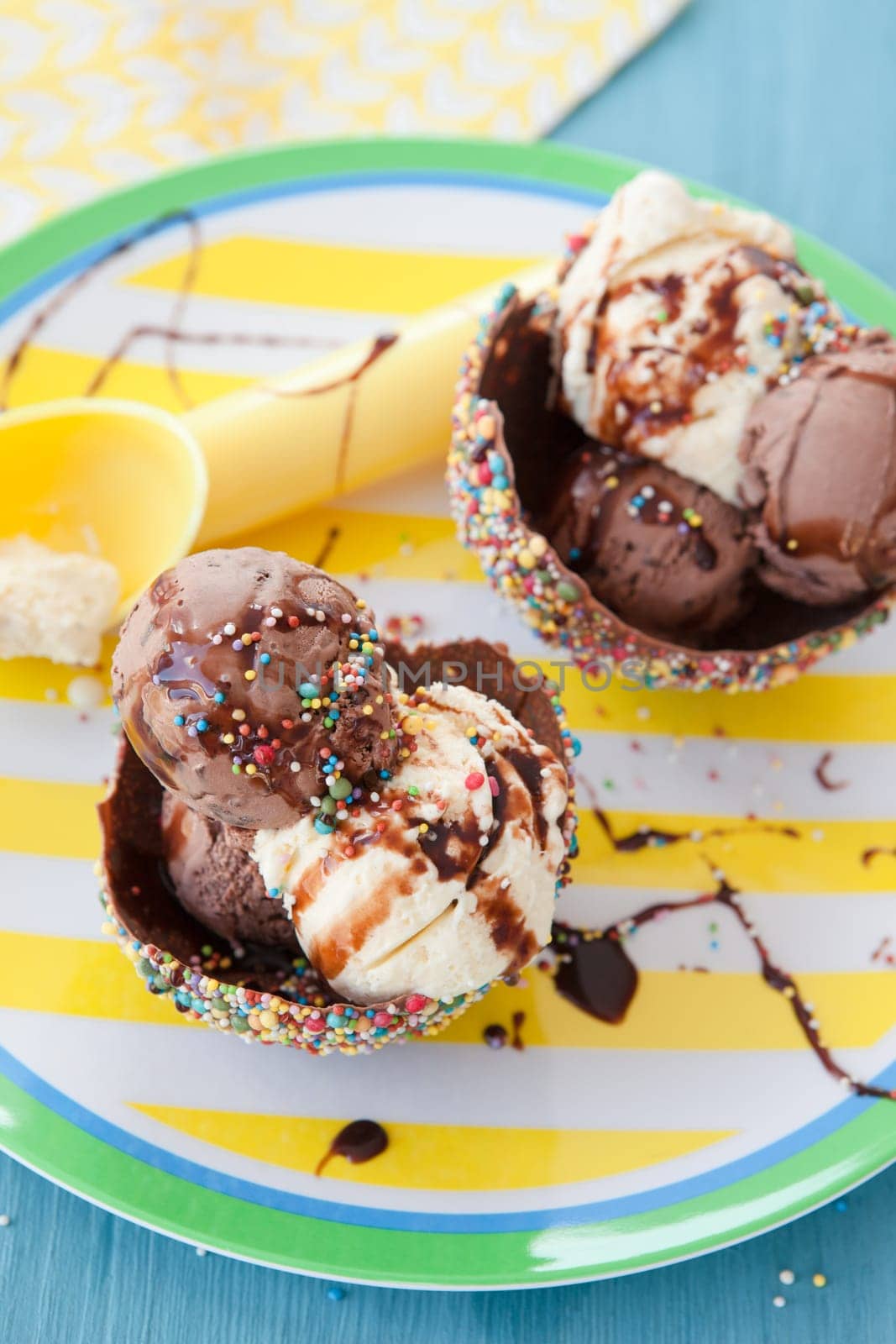 Ice cream in small bowls of chocolate and sugar sprinkles