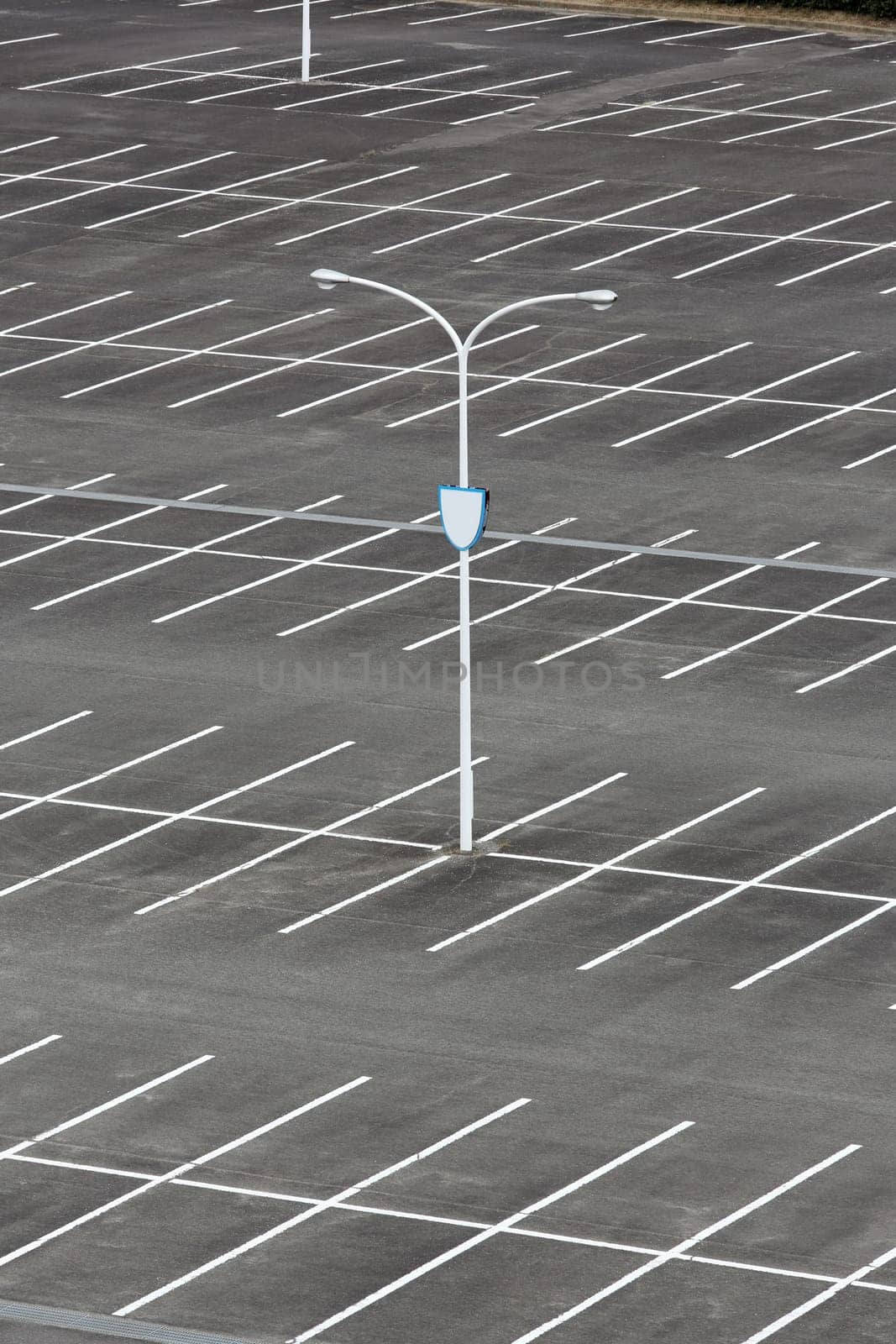 Car parking lot with white mark, light pole