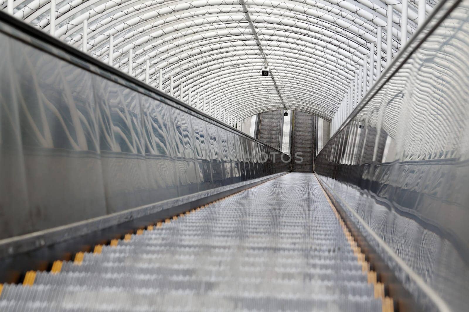 Outdoor escalator and stair with roof, close up