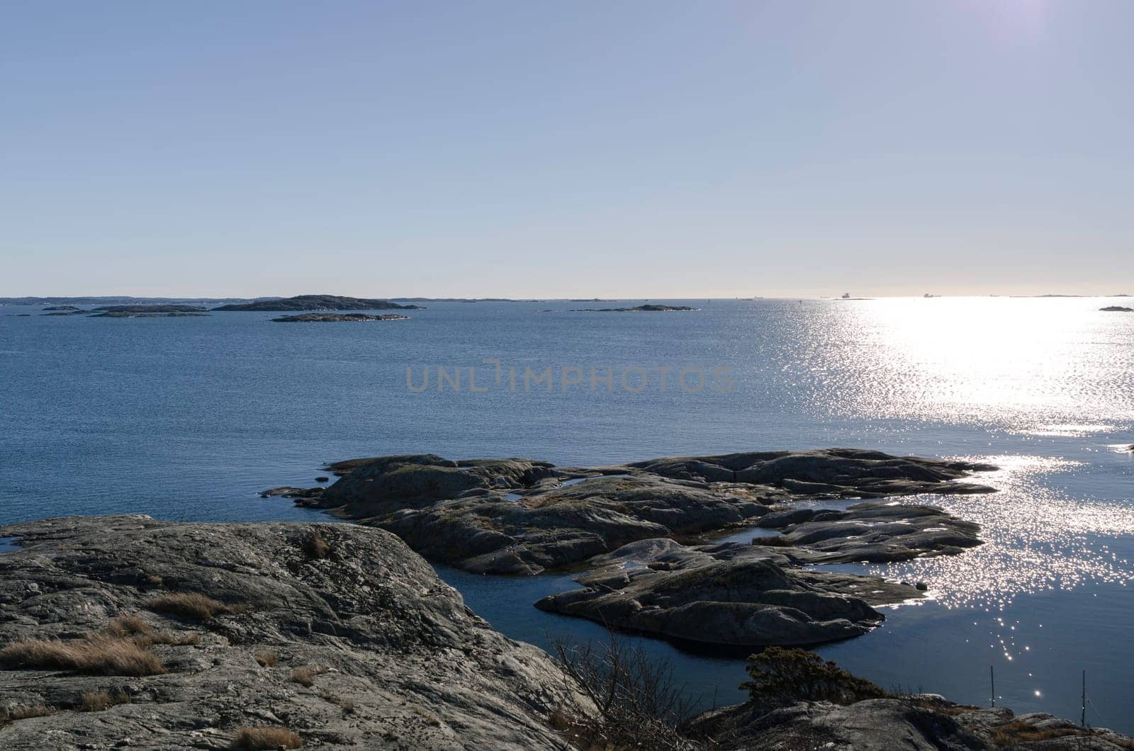 the sun is going down on the swedish west-coast outside Gothenburg in early spring
