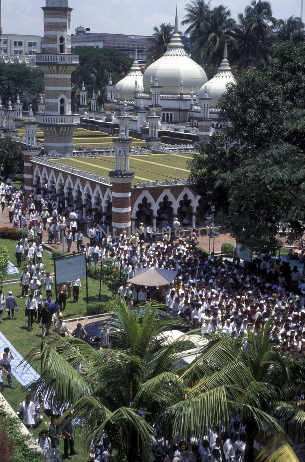 Muslim prayers at a Mosque in the city of  Kuala Lumpur in Malaysia in southeastasia.