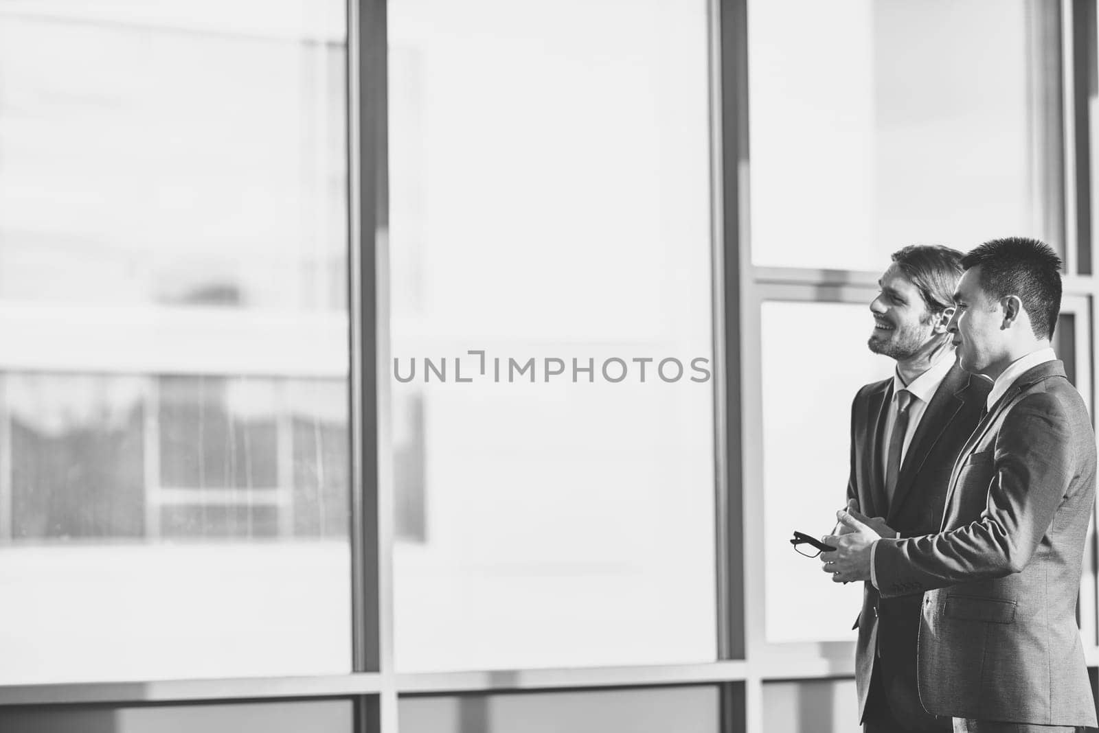 Happy businessmen discussing and sharing ideas