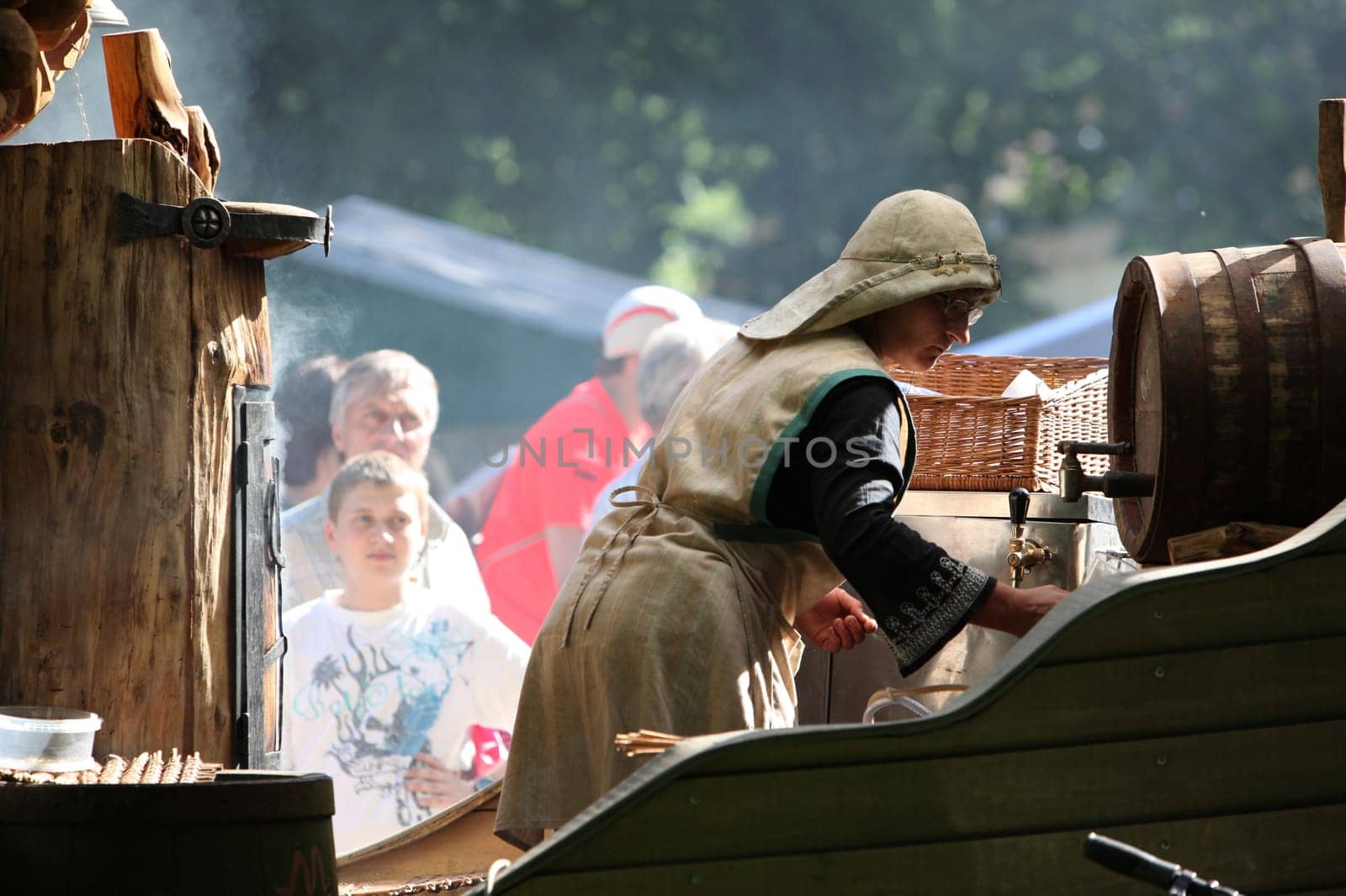 fresh fish getting smoket on a Summer Festival in a Parc in the old City of Vilnius in the Baltic State of Lithuania