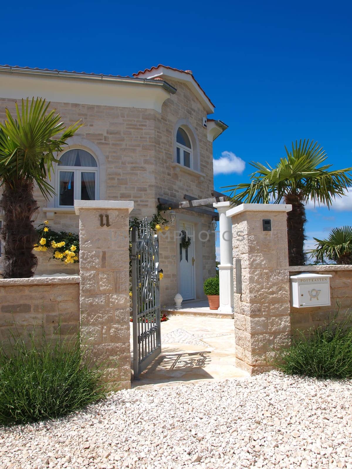 stone house open door and mail box