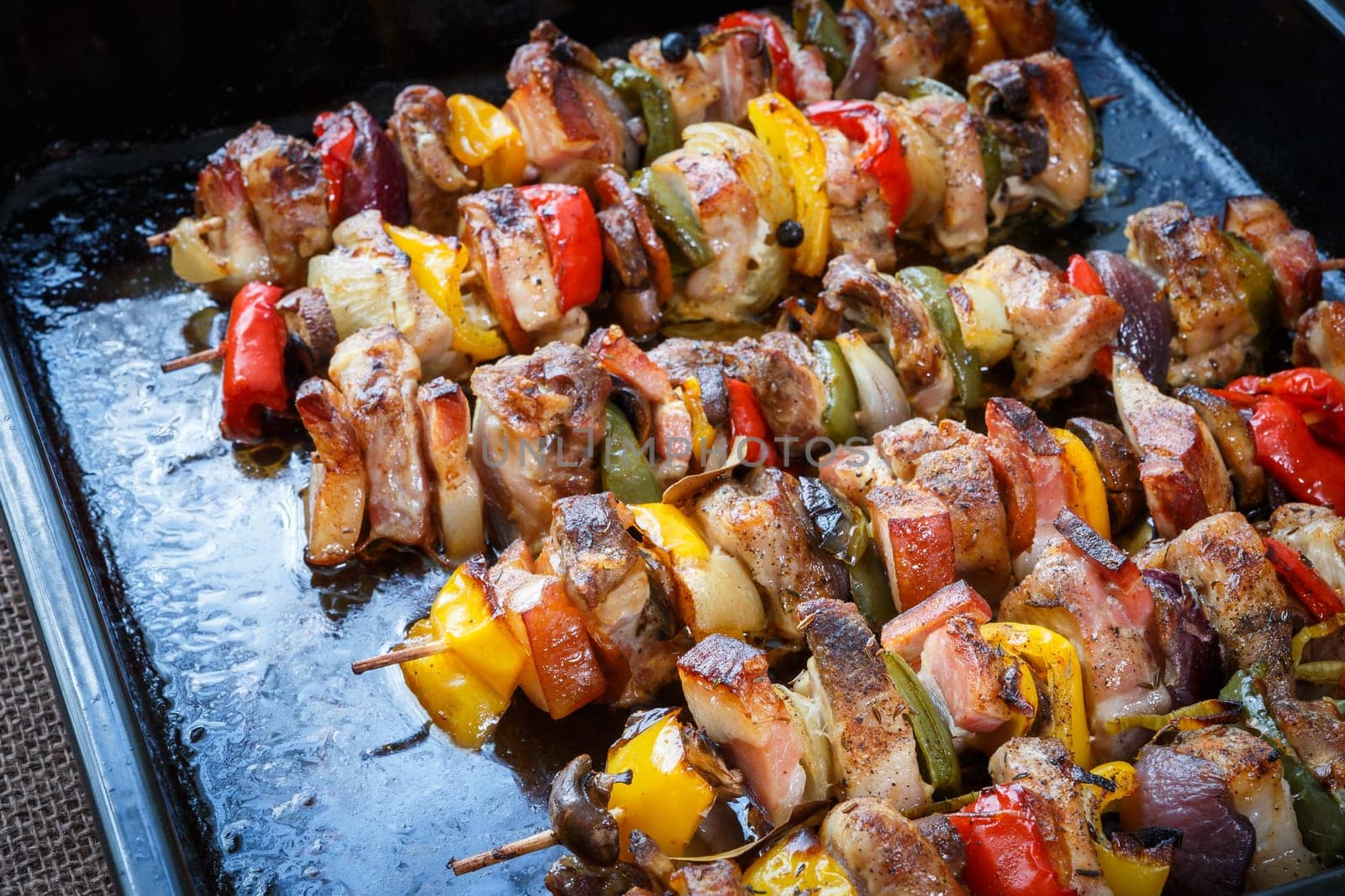 Tasty delicious pork skewer sticks - grilled pork kebab with red and yellow pepper