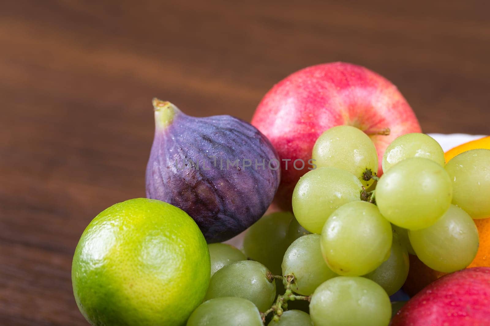 Assortment fruits on wooden table