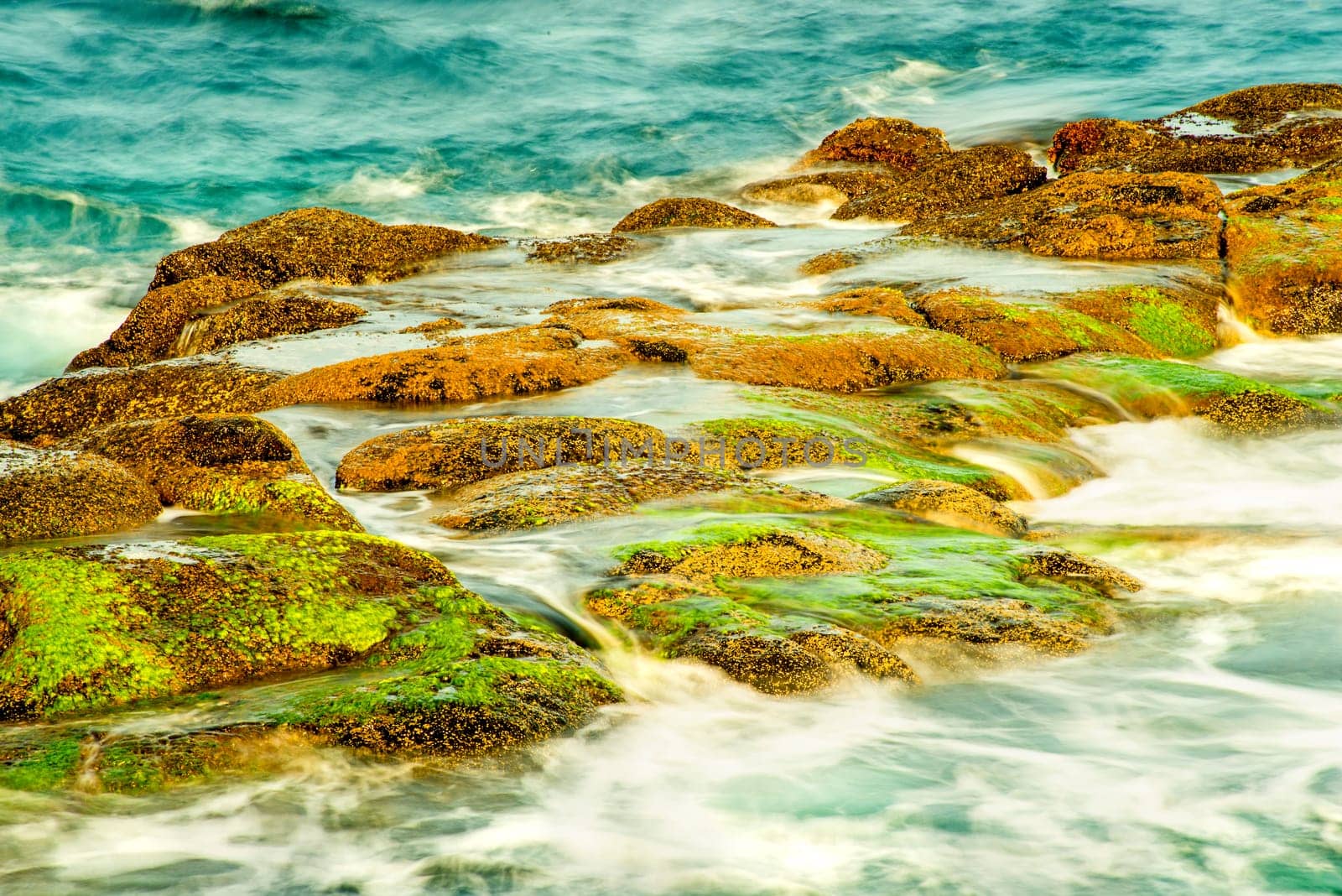 Surf of the Atlantic Ocean with rocks in long exposure