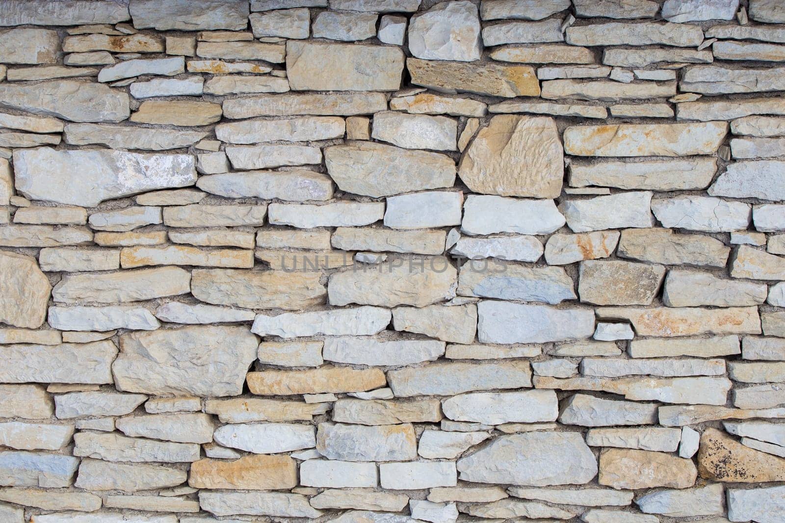Stone wall. Outdoor background natural stone - sandstone