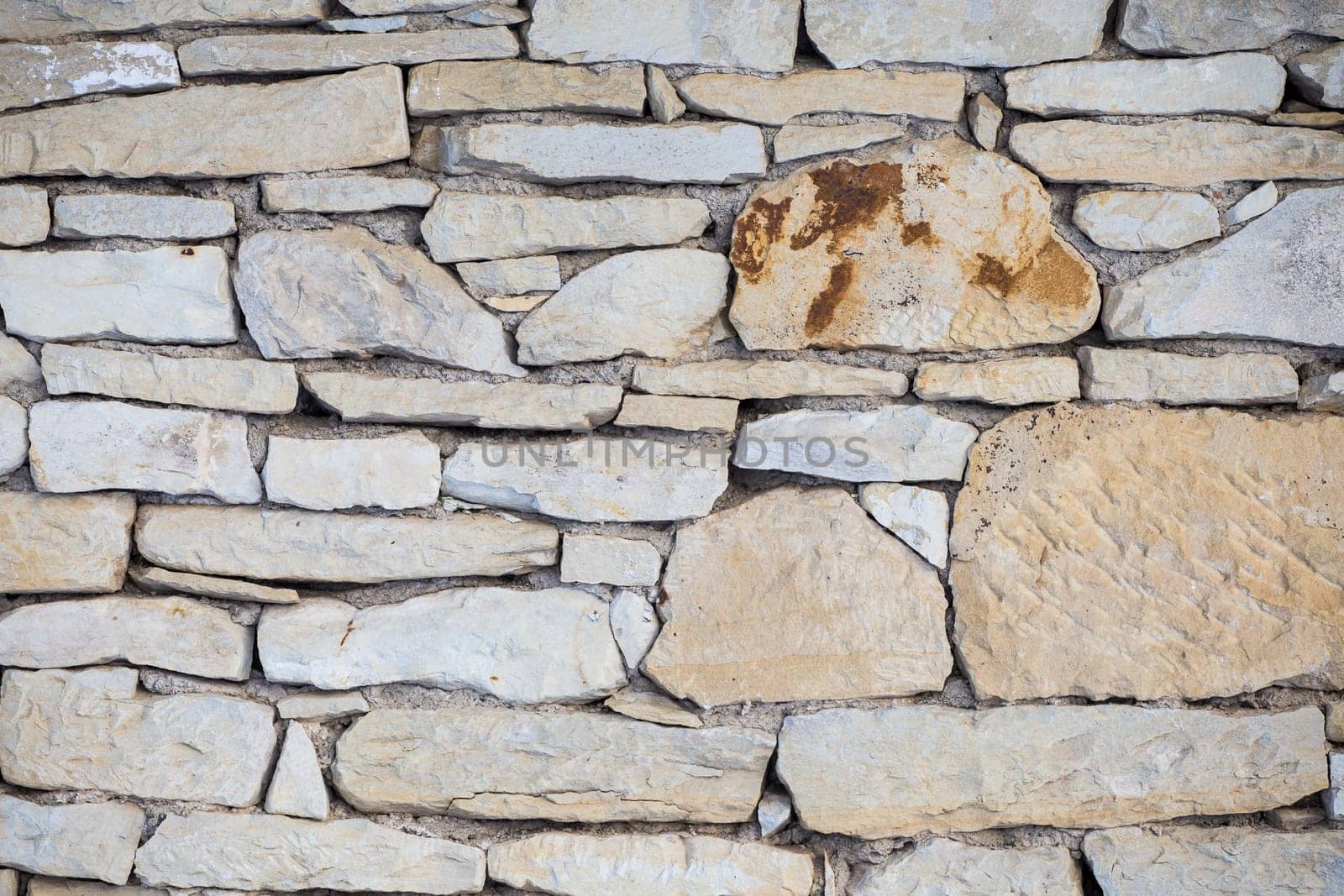 Stone wall. Outdoor background natural stone - sandstone