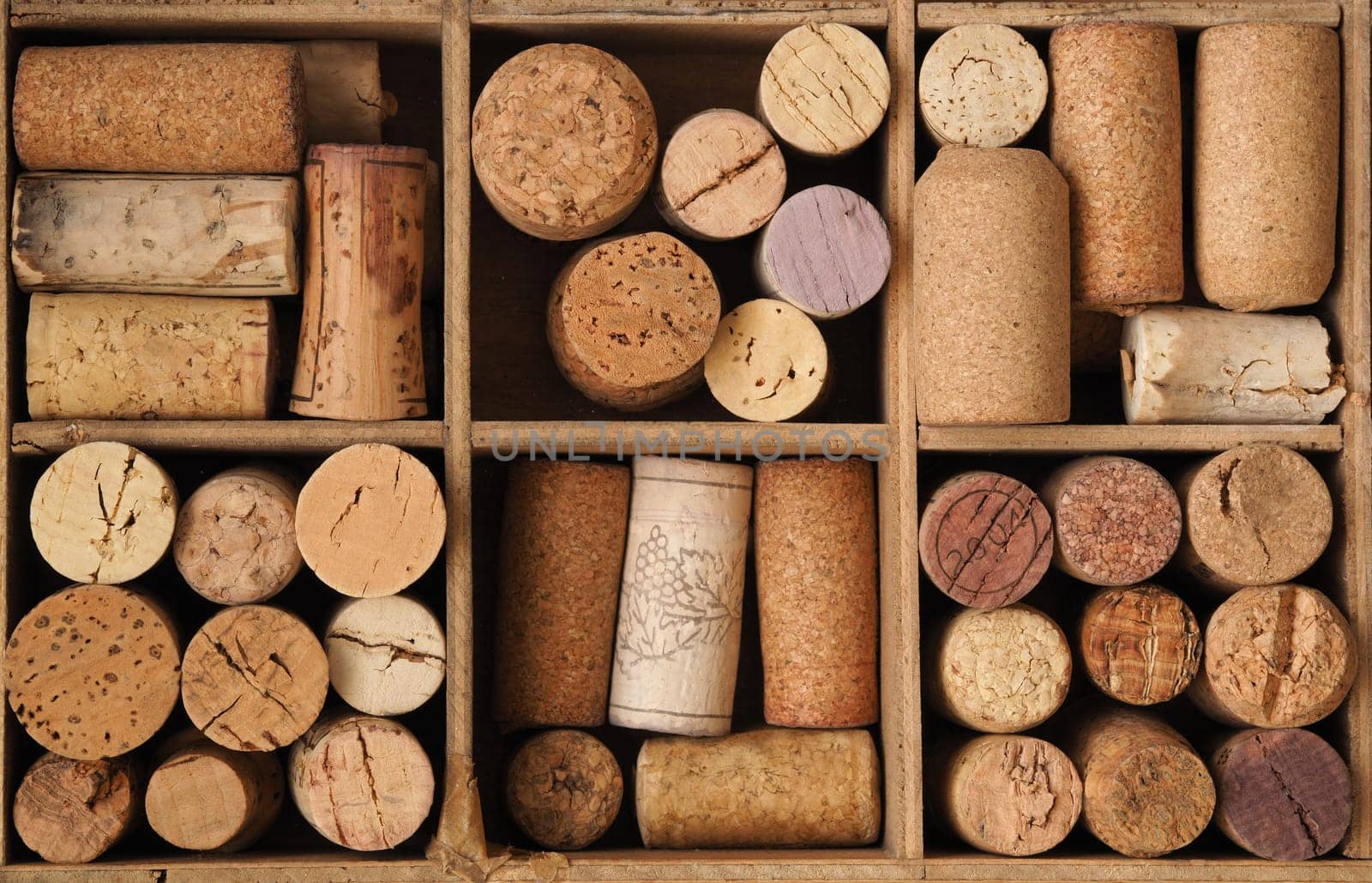 Bottle cork in an old wooden box using as background or header