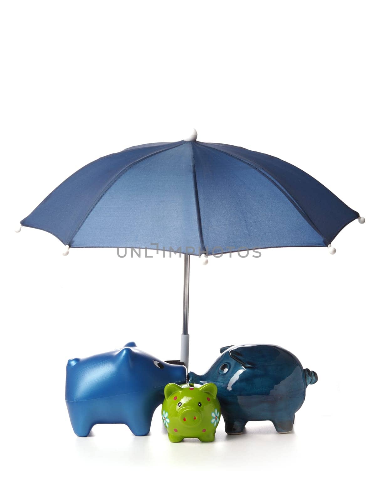 Protect your savings, Three piggy bank with an umbrella on a white background