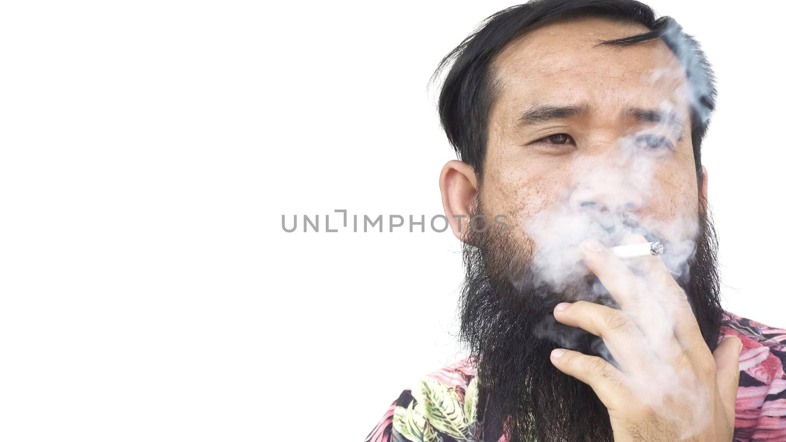 Portrait of adult man who is smoking cigarette