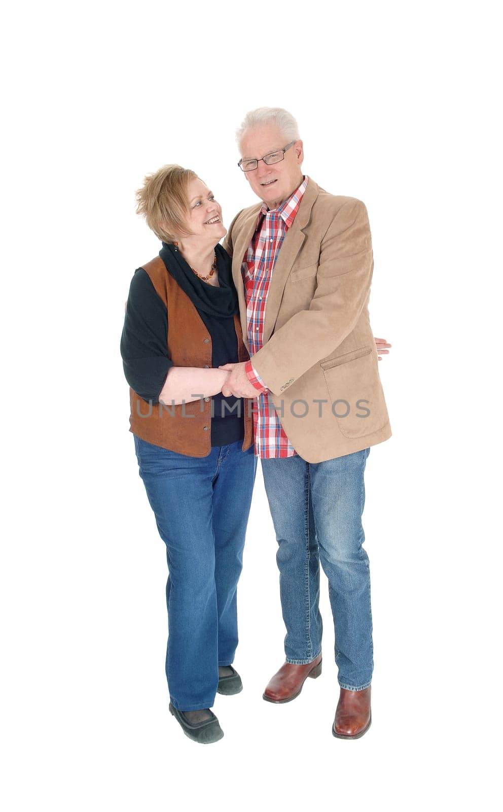 A lovely older couple standing in casual cloth, hugging each other, .smiling, isolated for white background..