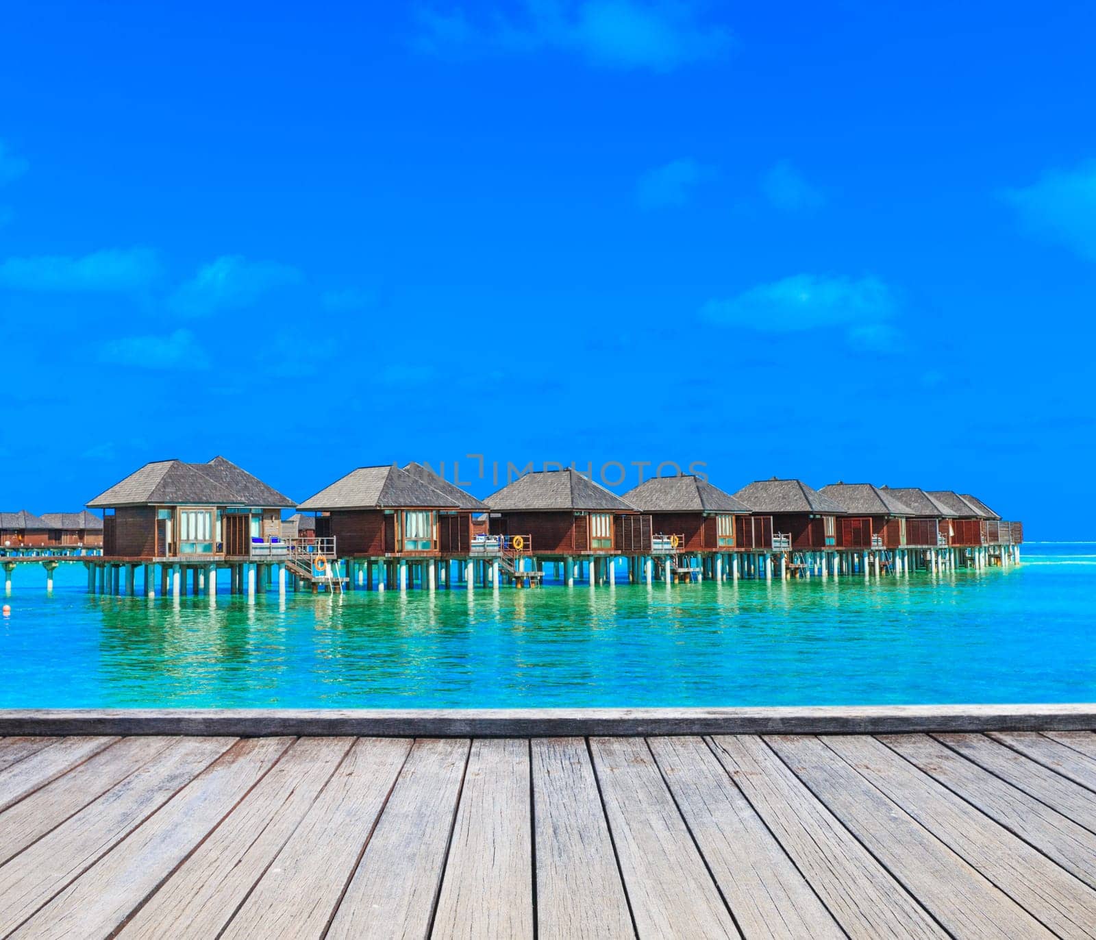 beach with water bungalows at Maldives