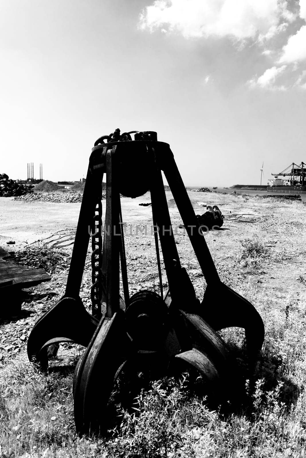 left behind rusty iron stone grabber