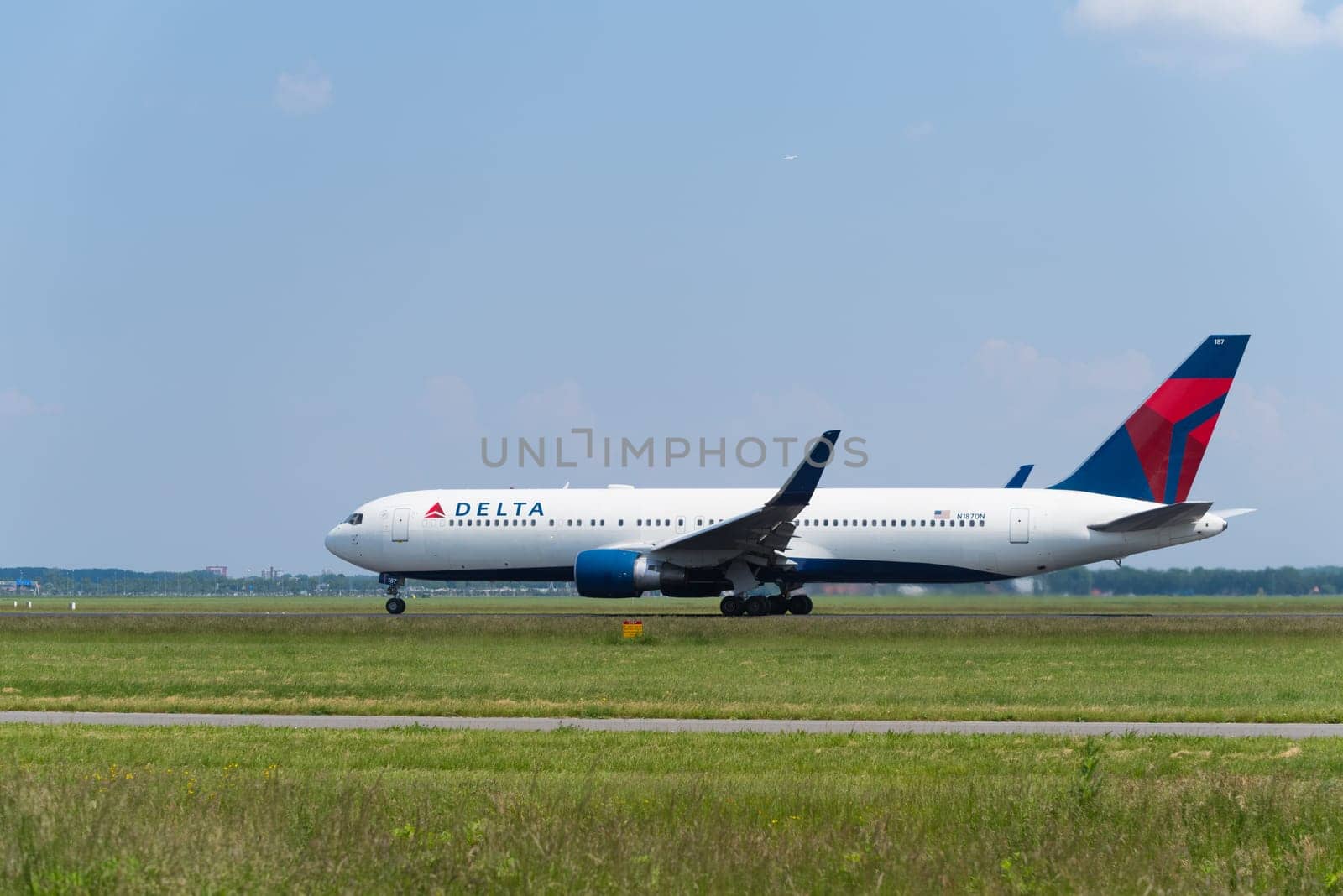 SCHIPHOL, NETHERLANDS - JUNE 4, 2016: Delta airlines plane takes off at amsterdam international airport
