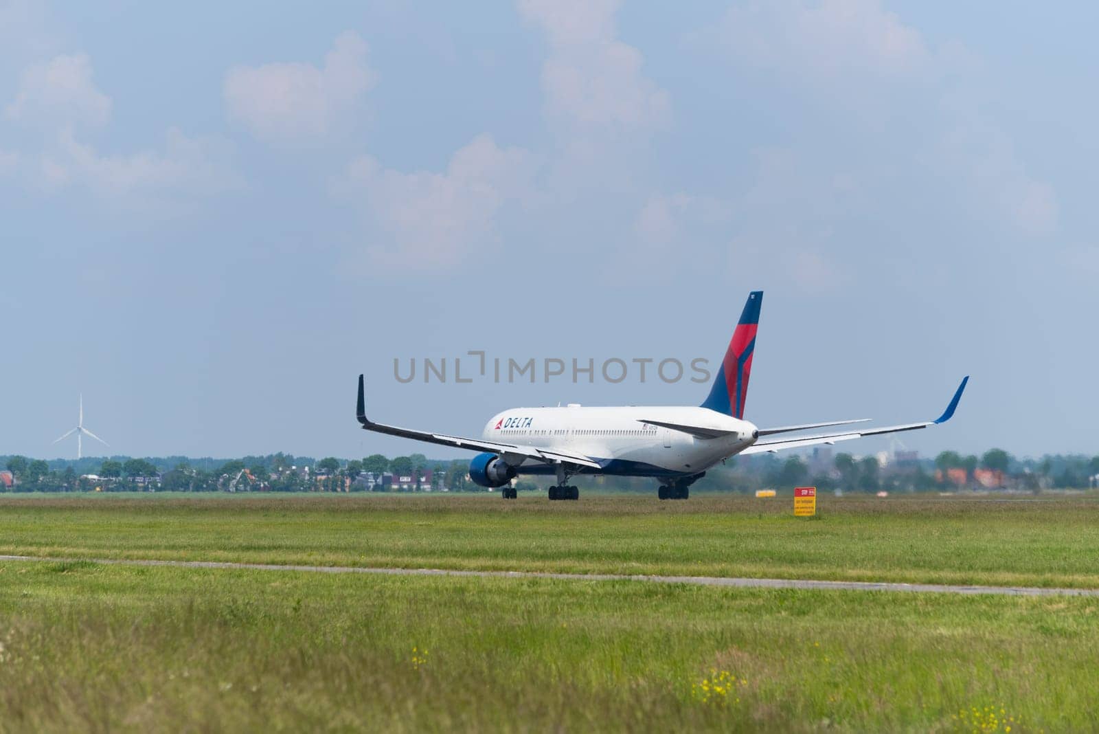 SCHIPHOL, NETHERLANDS - JUNE 4, 2016: Delta airlines plane takes off at amsterdam international airport