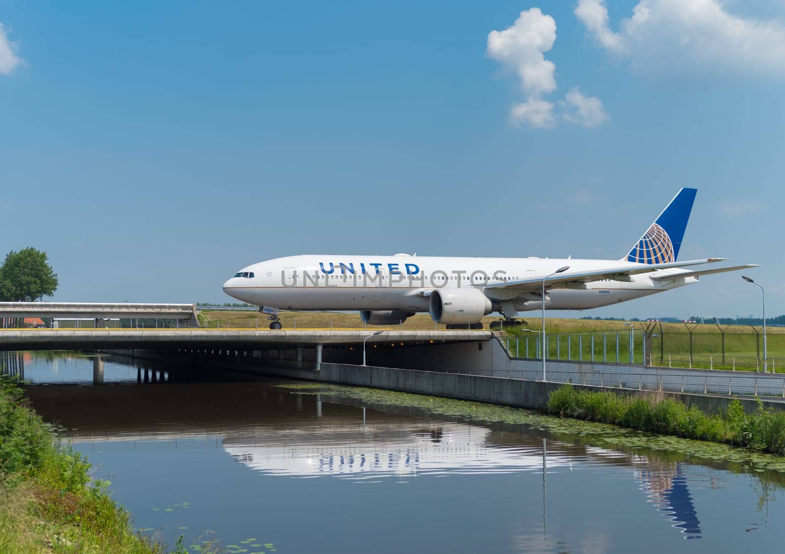 SCHIPHOL, NETHERLANDS - JUNE 4, 2016: United airplane taxiing to the runway on amsterdam schiphol airport