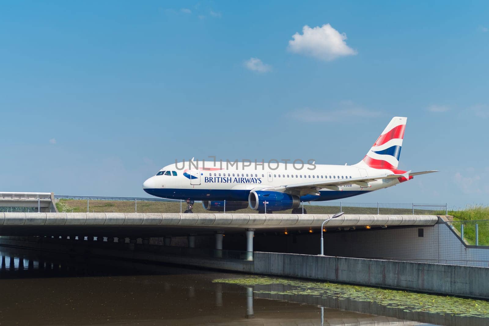 SCHIPHOL, NETHERLANDS - JUNE 4, 2016: British airways airplane taxiing to the runway on amsterdam schiphol airport