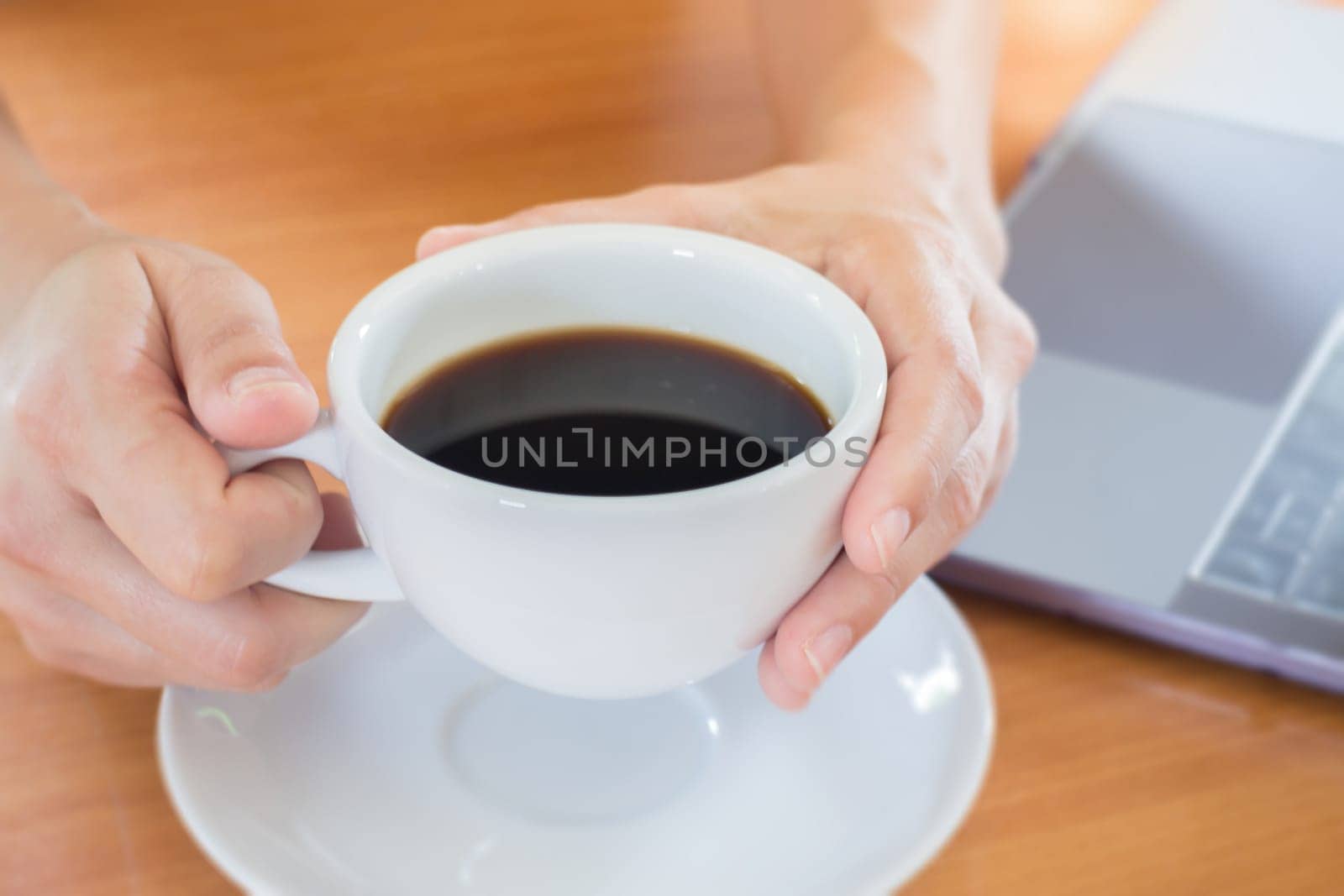 Hand On Hot Cup Of Coffee, stock photo