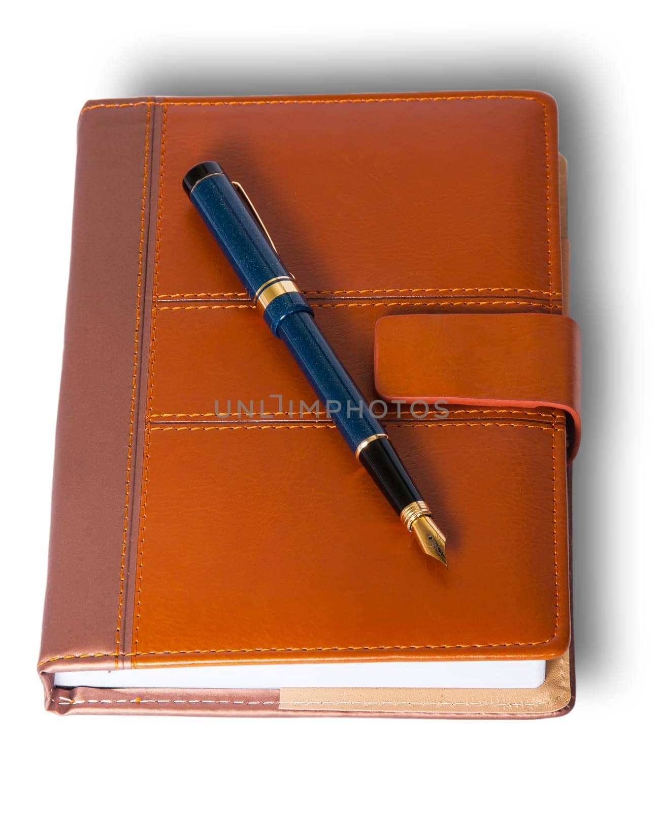 Fountain pen on top of the closed notebook isolated on white background