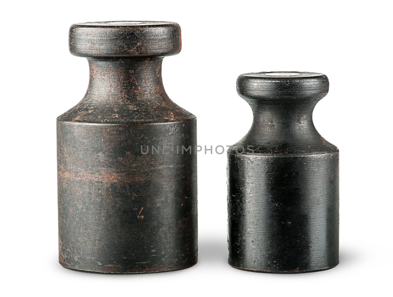 Two old rusty scale weights isolated on white background