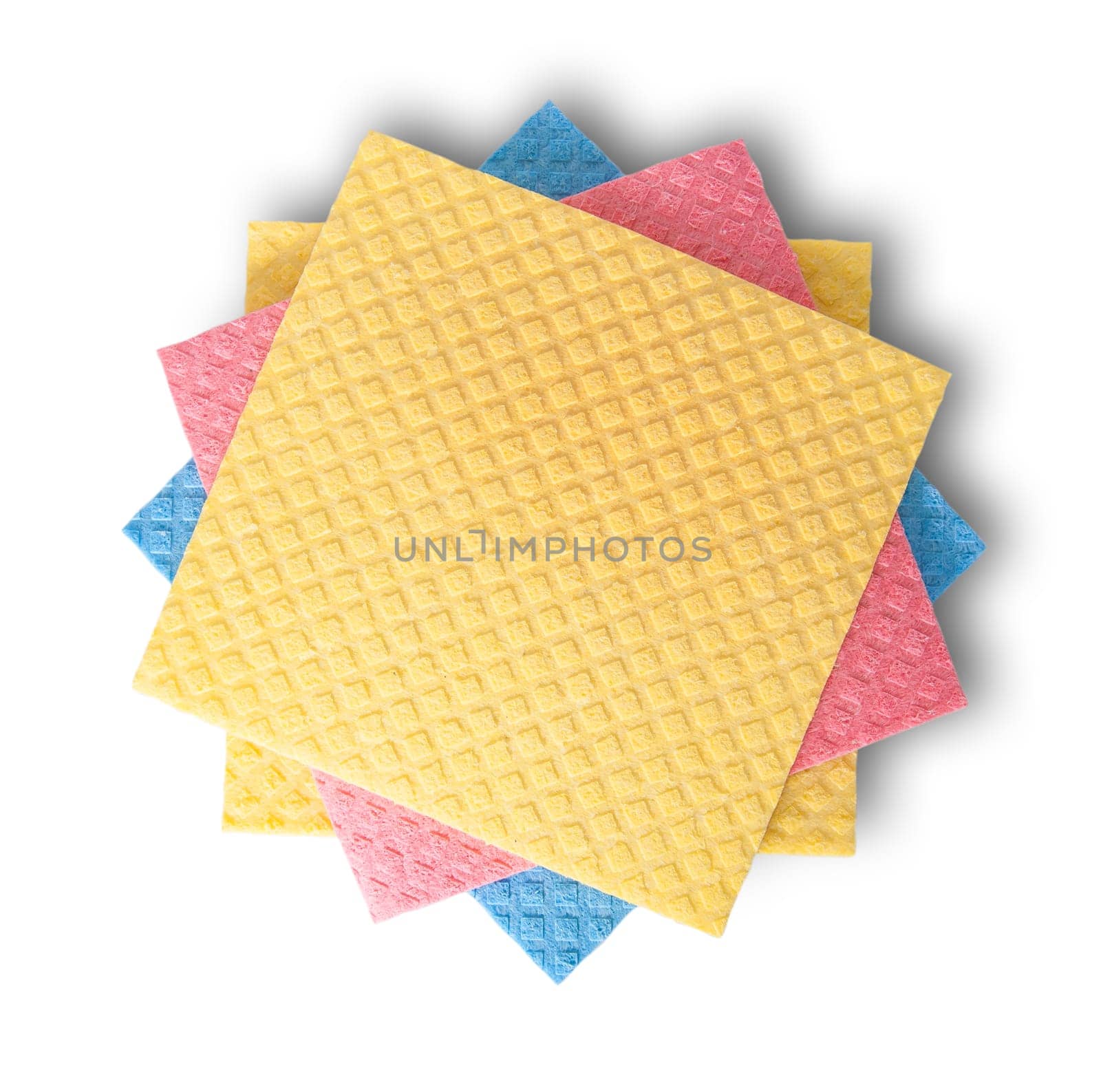 Multicolored sponges for dishwashing in chaotic order top view isolated on white background