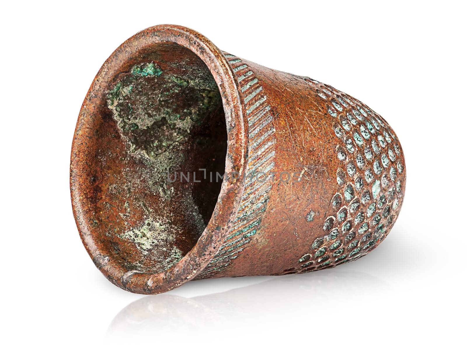 Old antique copper thimble horizontally isolated on white background