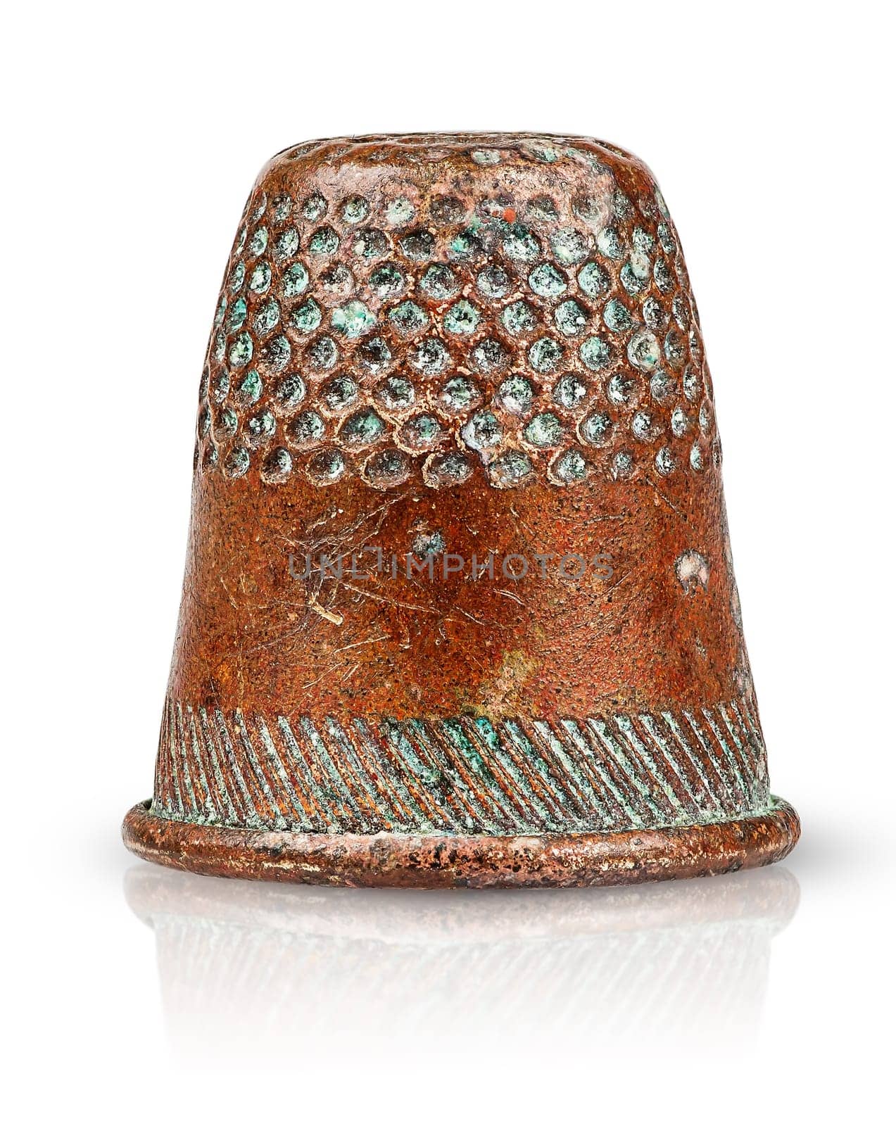 Old antique copper thimble isolated on white background