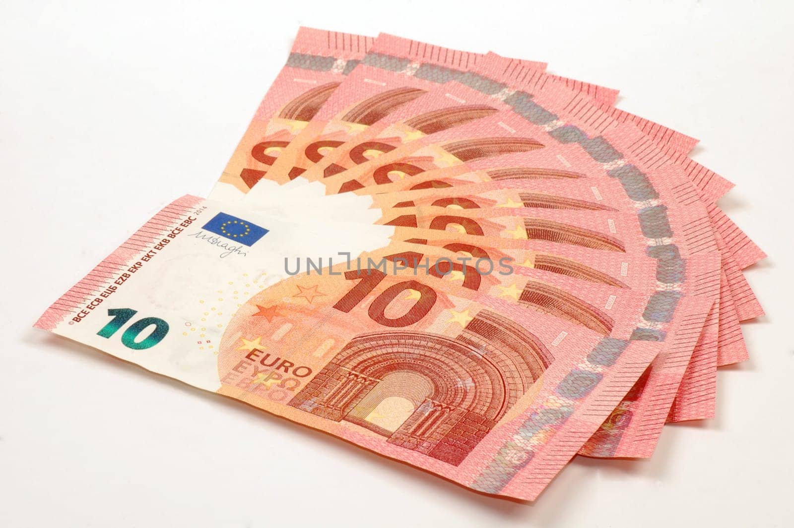 Euro banknotes of ten euro are on white background.