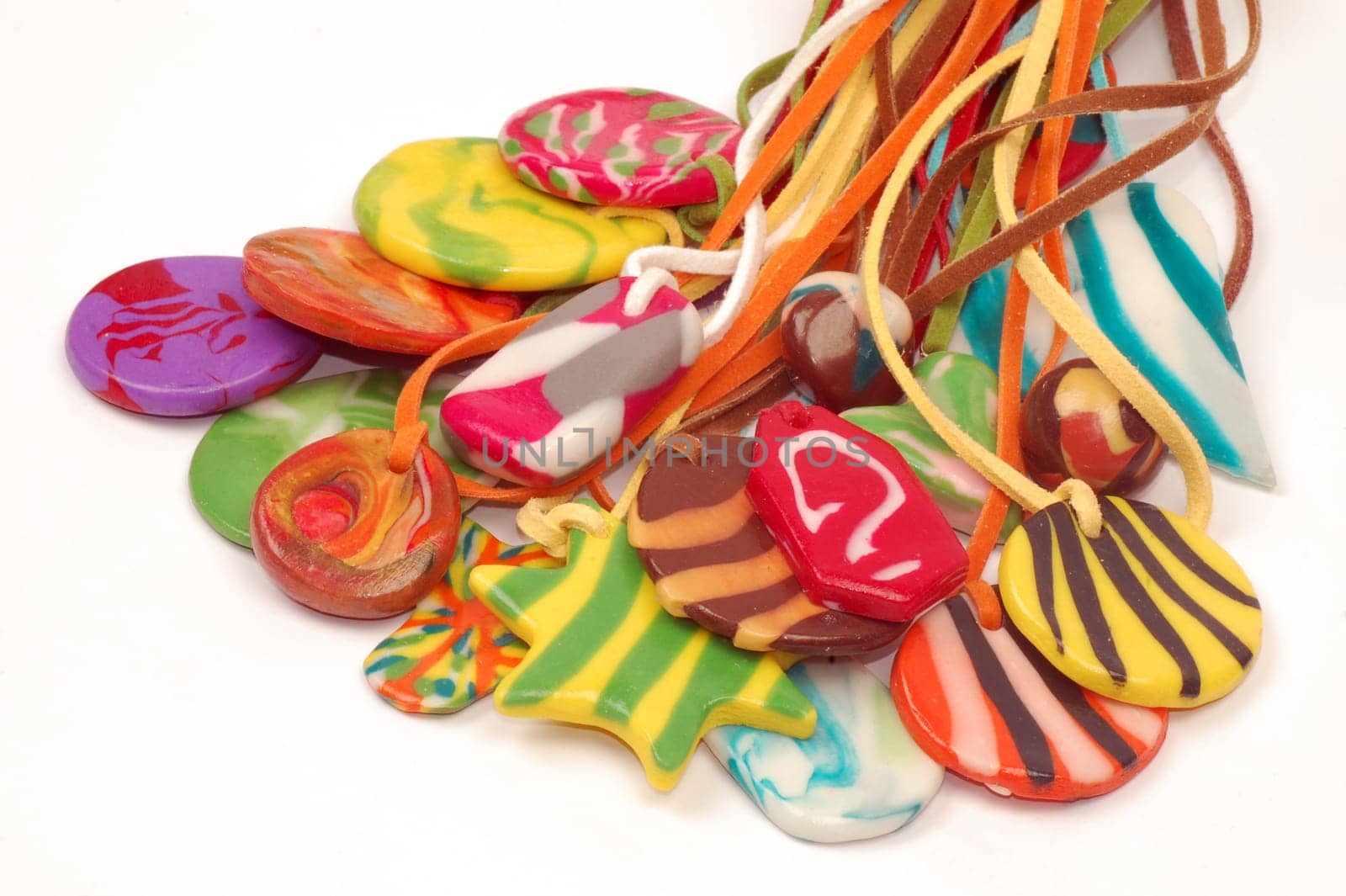 Colorful handmade jewelry isolated on white background.