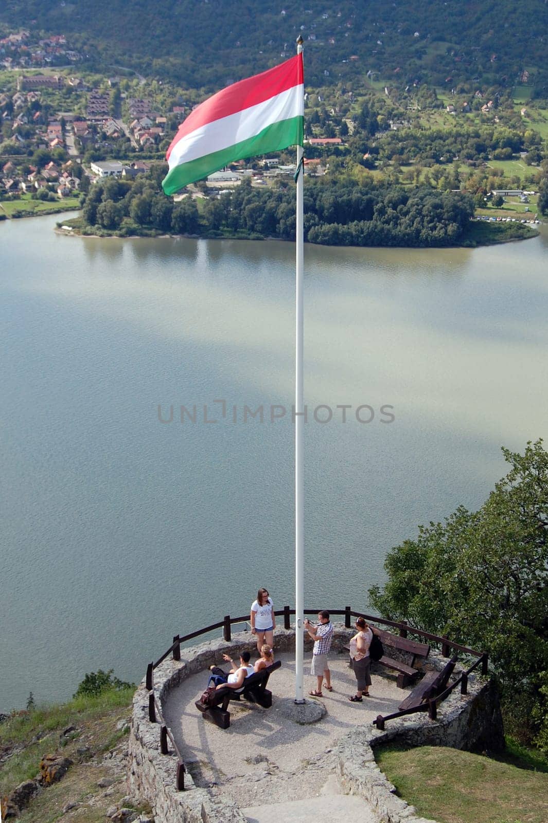 The Hungarian flag with beautiful landscape background in Visegrad.