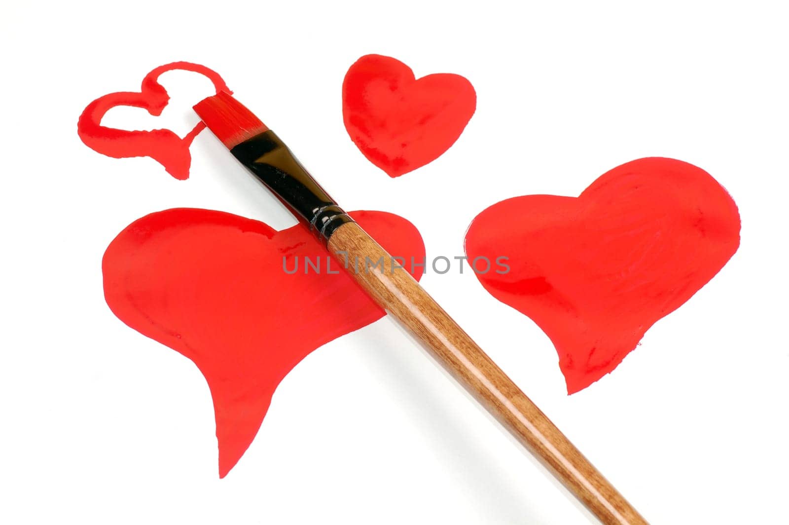 Four red hearts are painted with paintbrush.