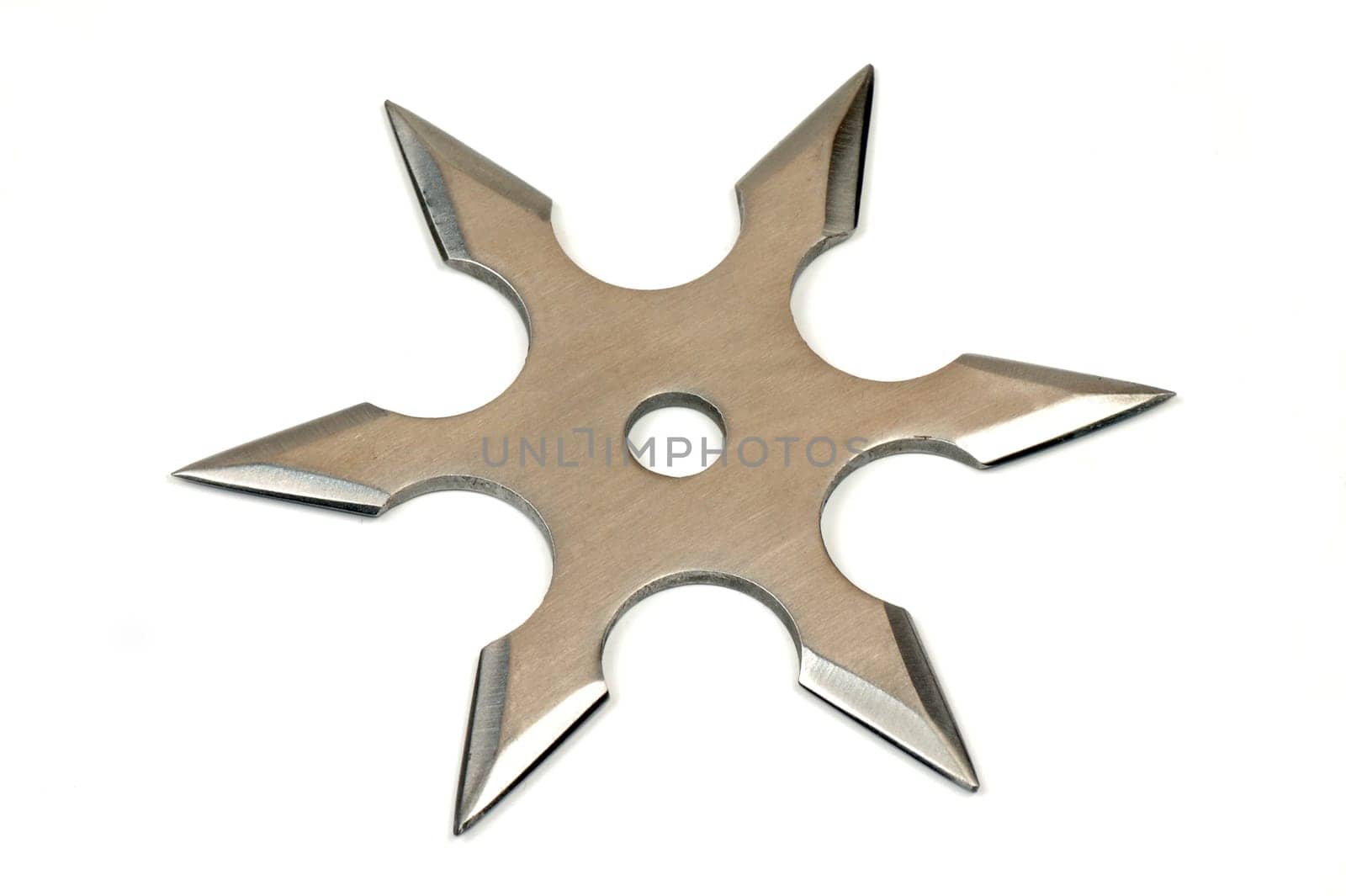 Silver shuriken of star shape on white background.