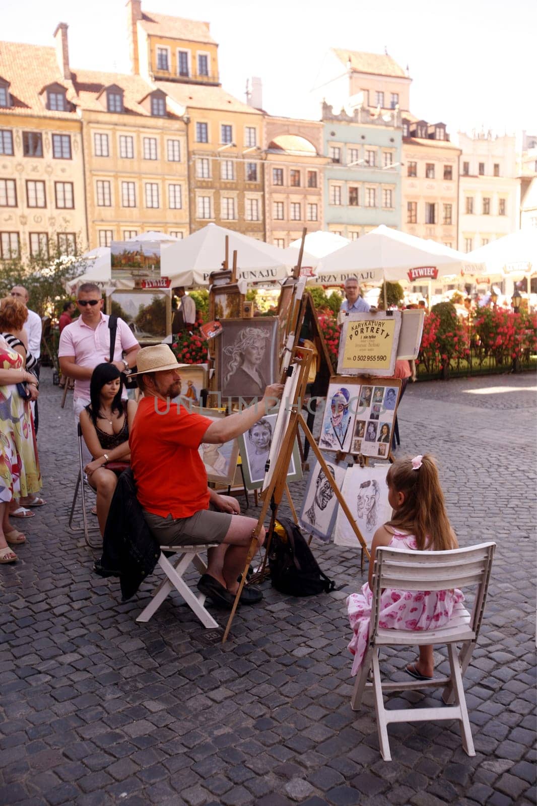 The Zamkowy Square in the old Town in the City of Warsaw in Poland.