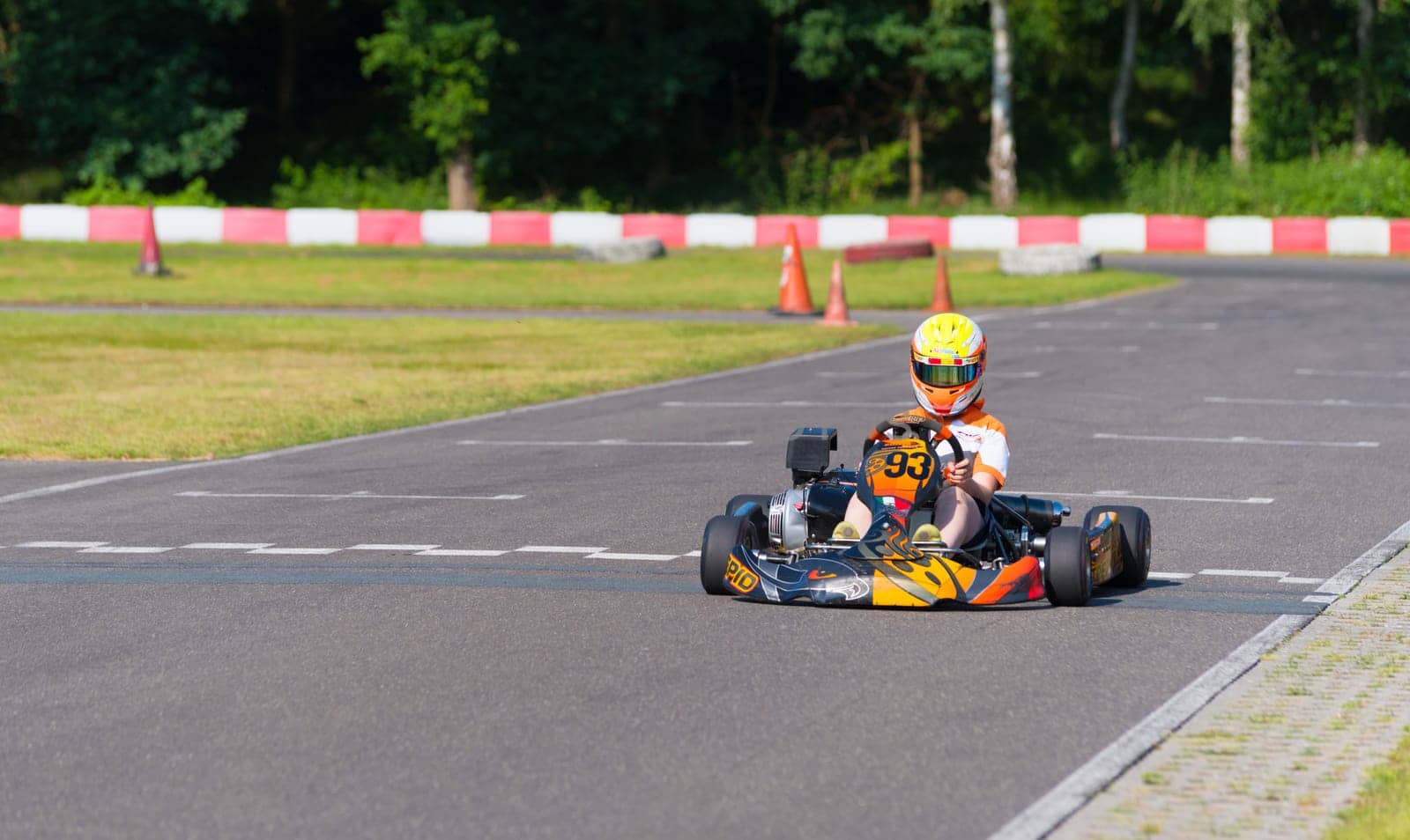 OLDENZAAL, NETHERLANDS - JUNE 7, 2016: Boy karting on an empty karting track
