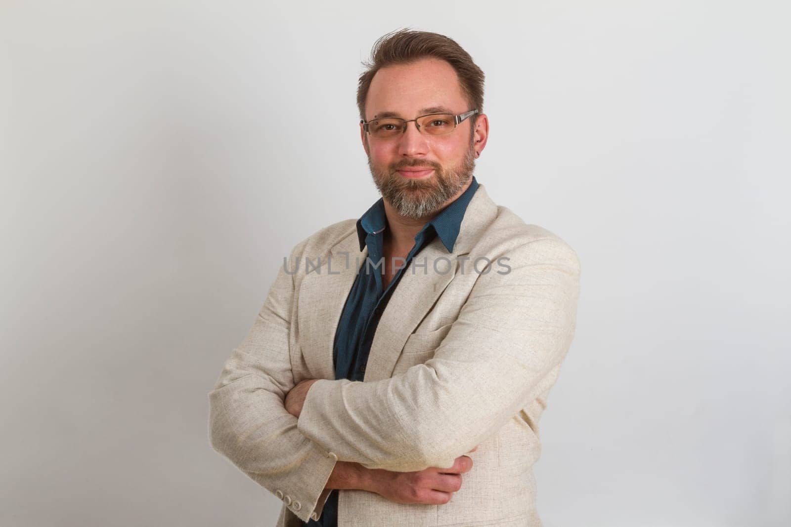 Attractive man standing on a bright background