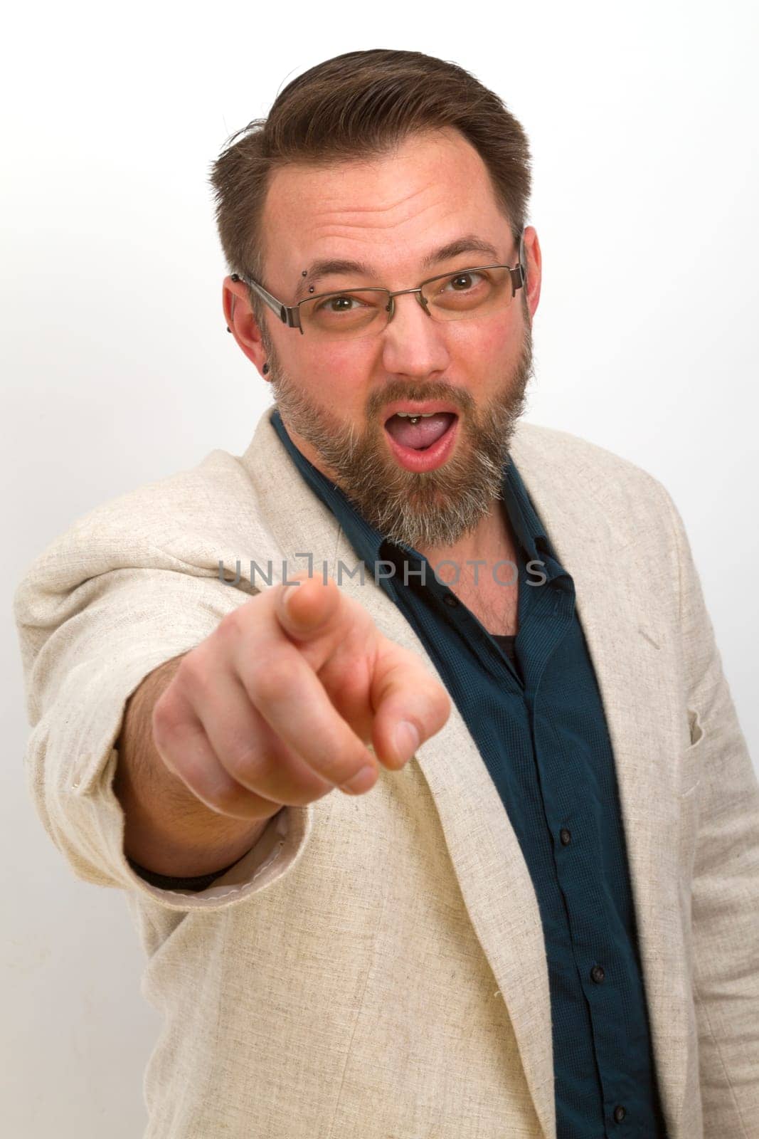 Man gesticulates with hand and shows fingers with a bright background