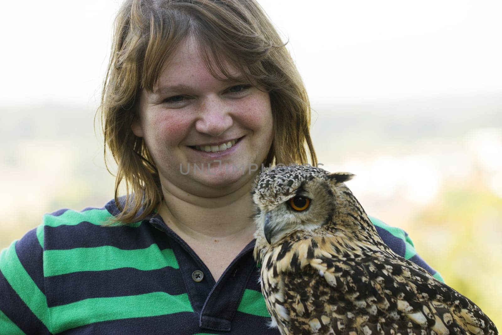 Young female keeps Indian eagle owl female