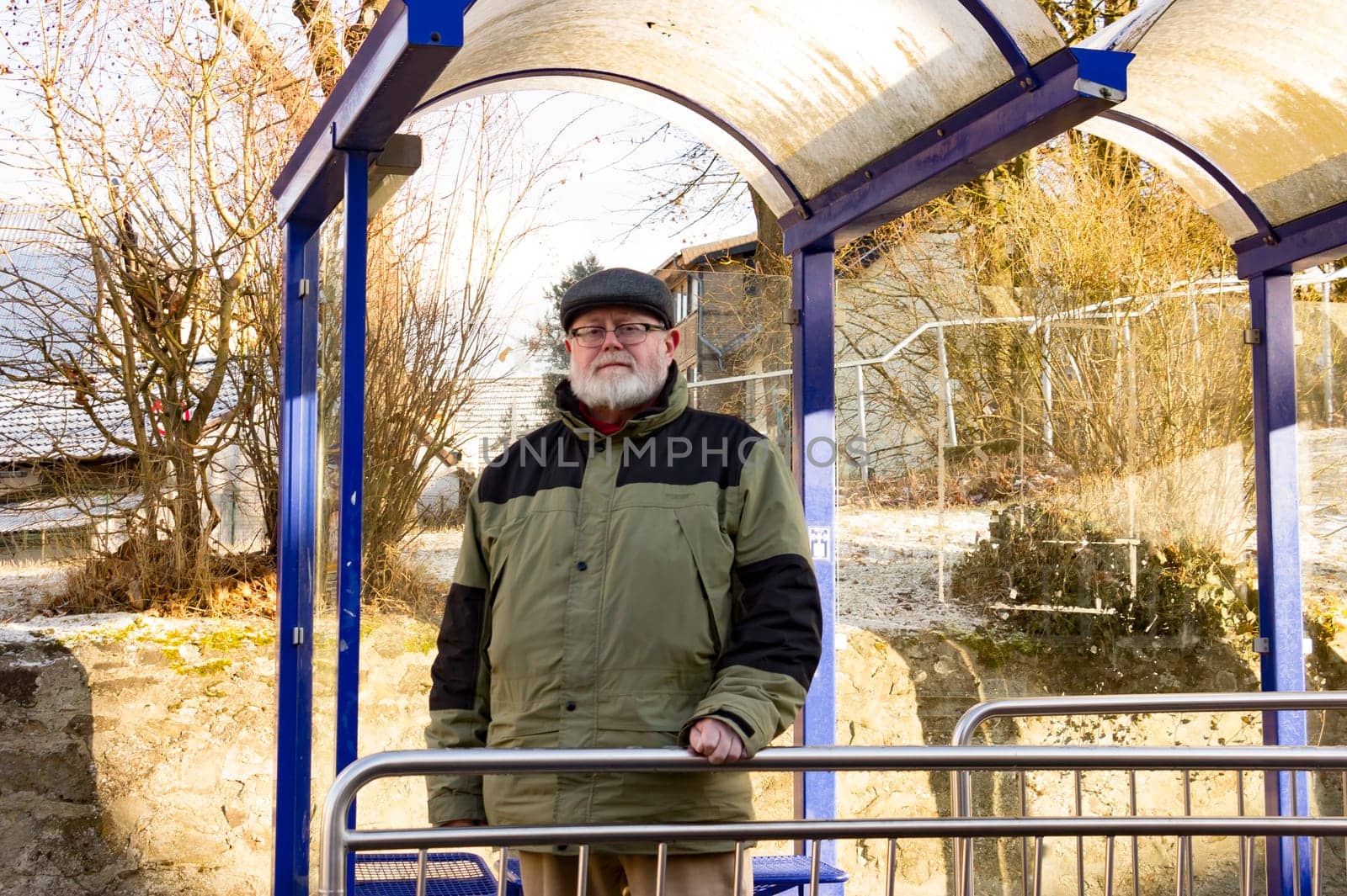 Senior waits at bus stop