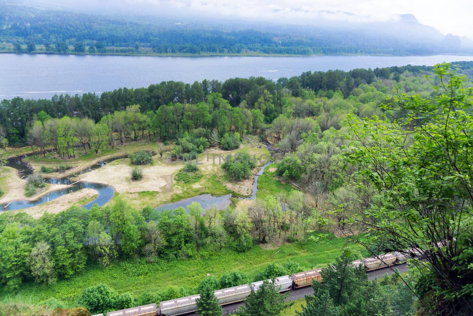 View of a train passing through the Columbia River Gorge near Portland, Oregon