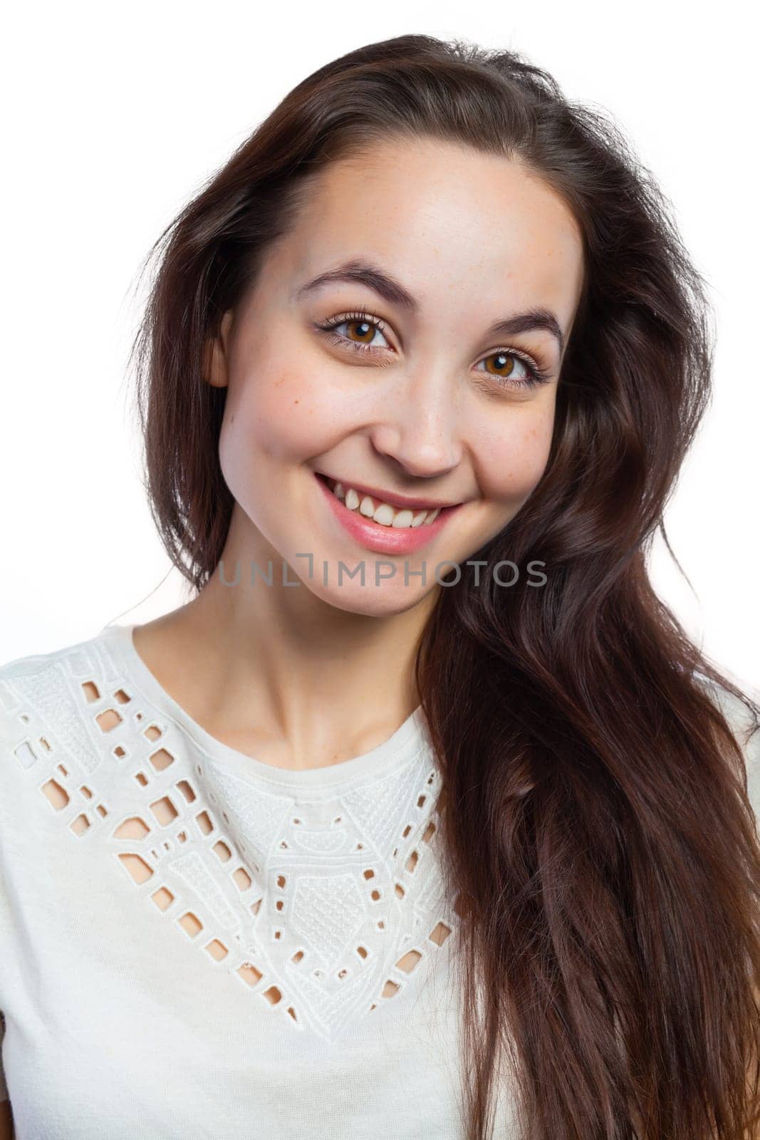 Close portrait of a charming young woman, isolated on white